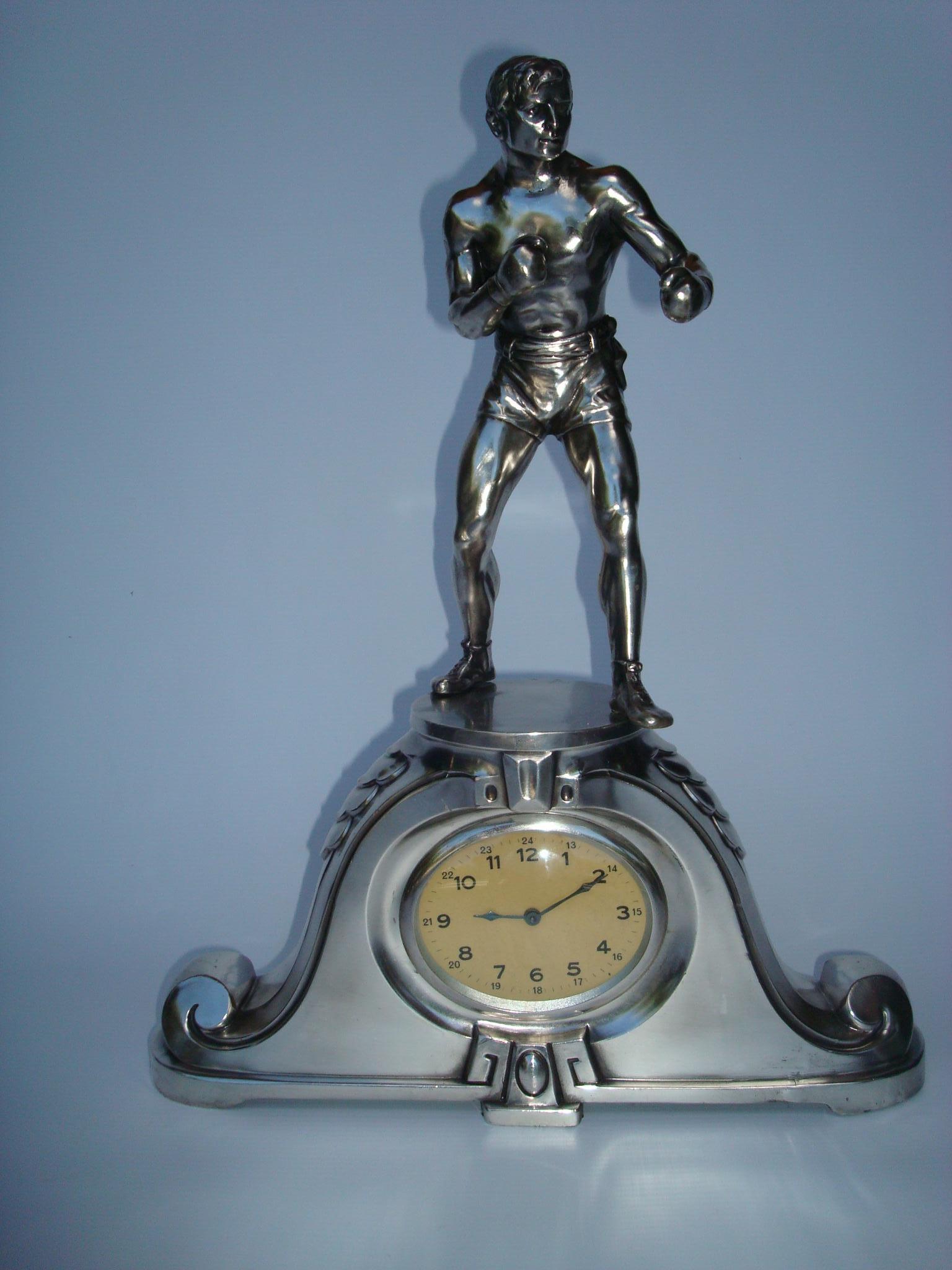 1920´s boxer clock. 
Clock has been repaired and it´s in working condition. Clock has been re-silvered.
Perfect Gift for any Box Fan.