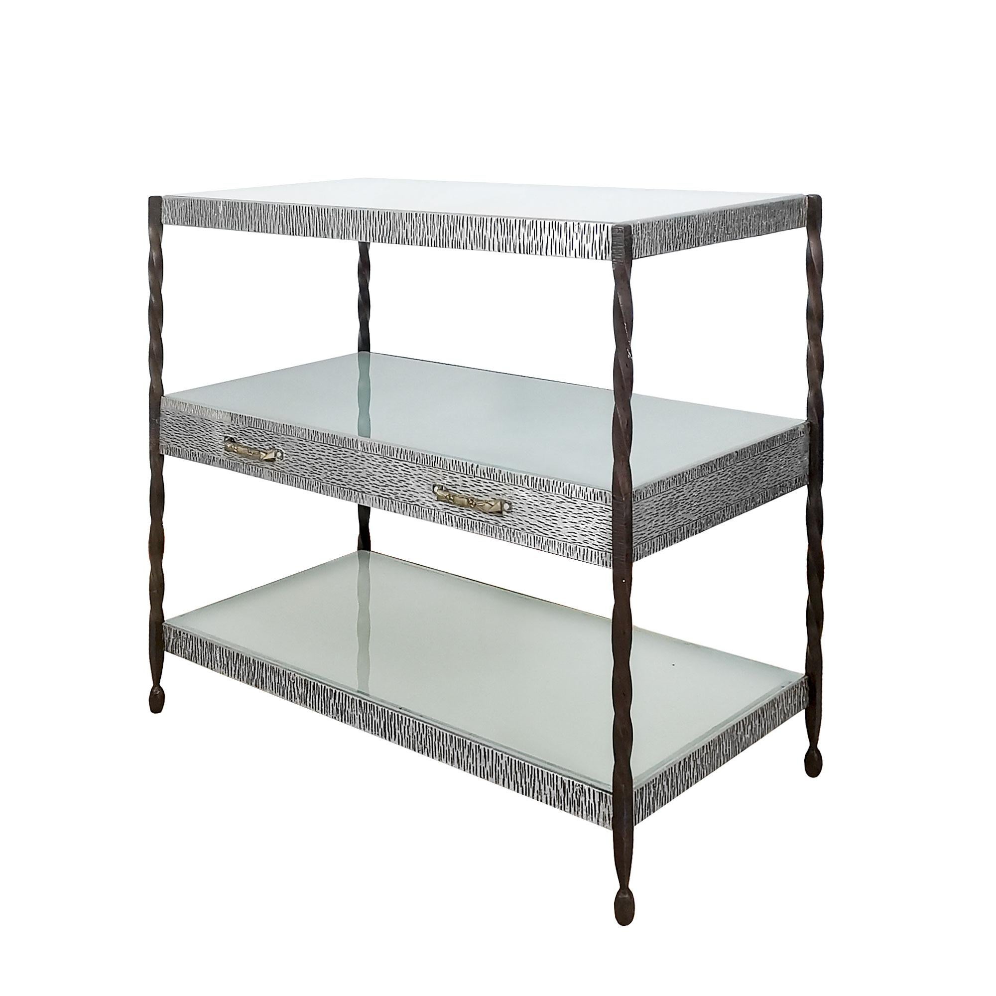 Center shelving unit, wrought iron and three metal plates with drypoint engraving in three levels. One drawer and three sandblast glasses, solid brass handles.

France, c. 1920.