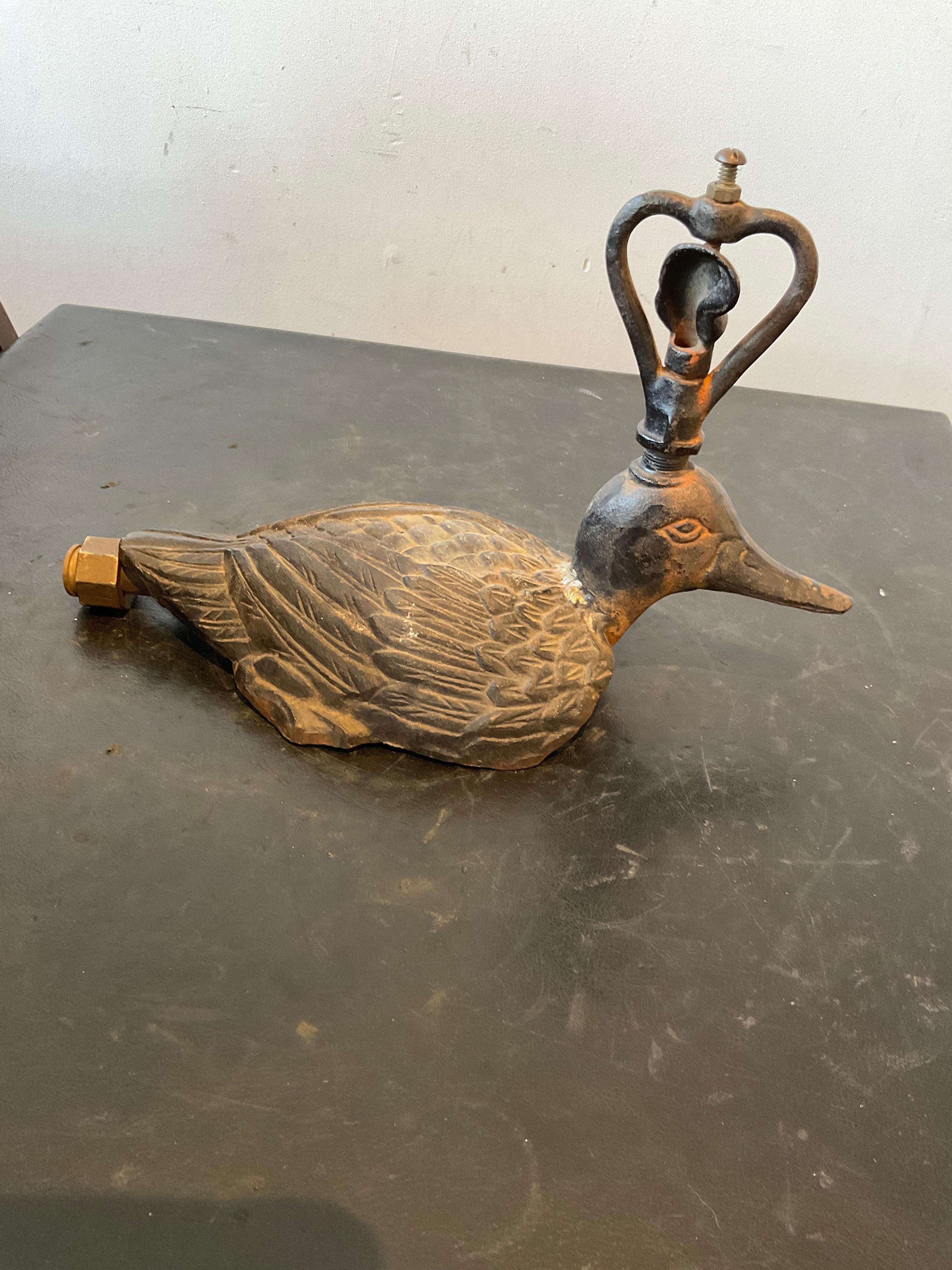1920s Iron duck sprinkler.