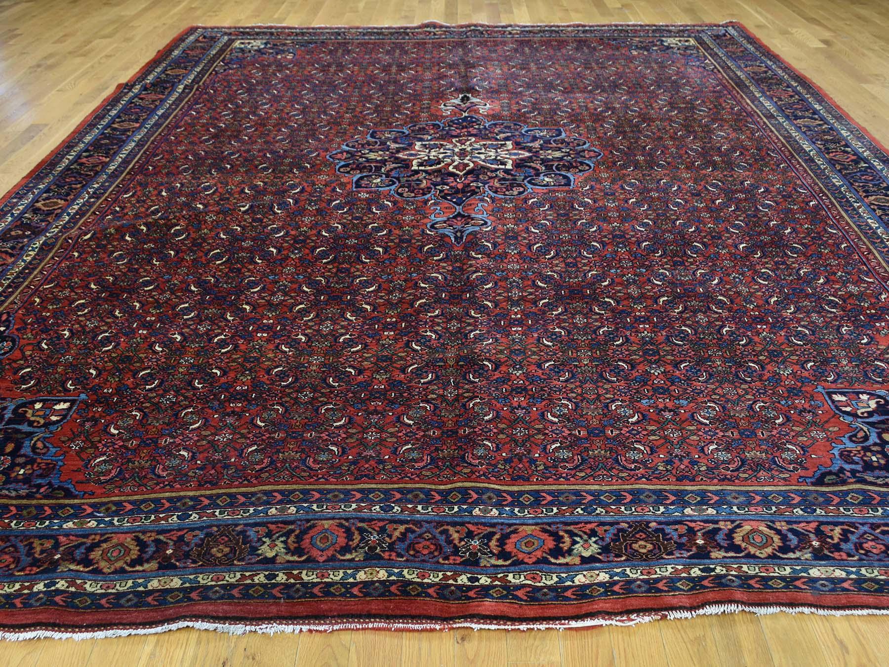 This is a genuine hand knotted oriental rug. It is not hand tufted or machine made rug. Our entire inventory is made of either hand knotted or handwoven rugs.

Decorate your home with this high quality antique carpet. This handcrafted Persian Bidjar