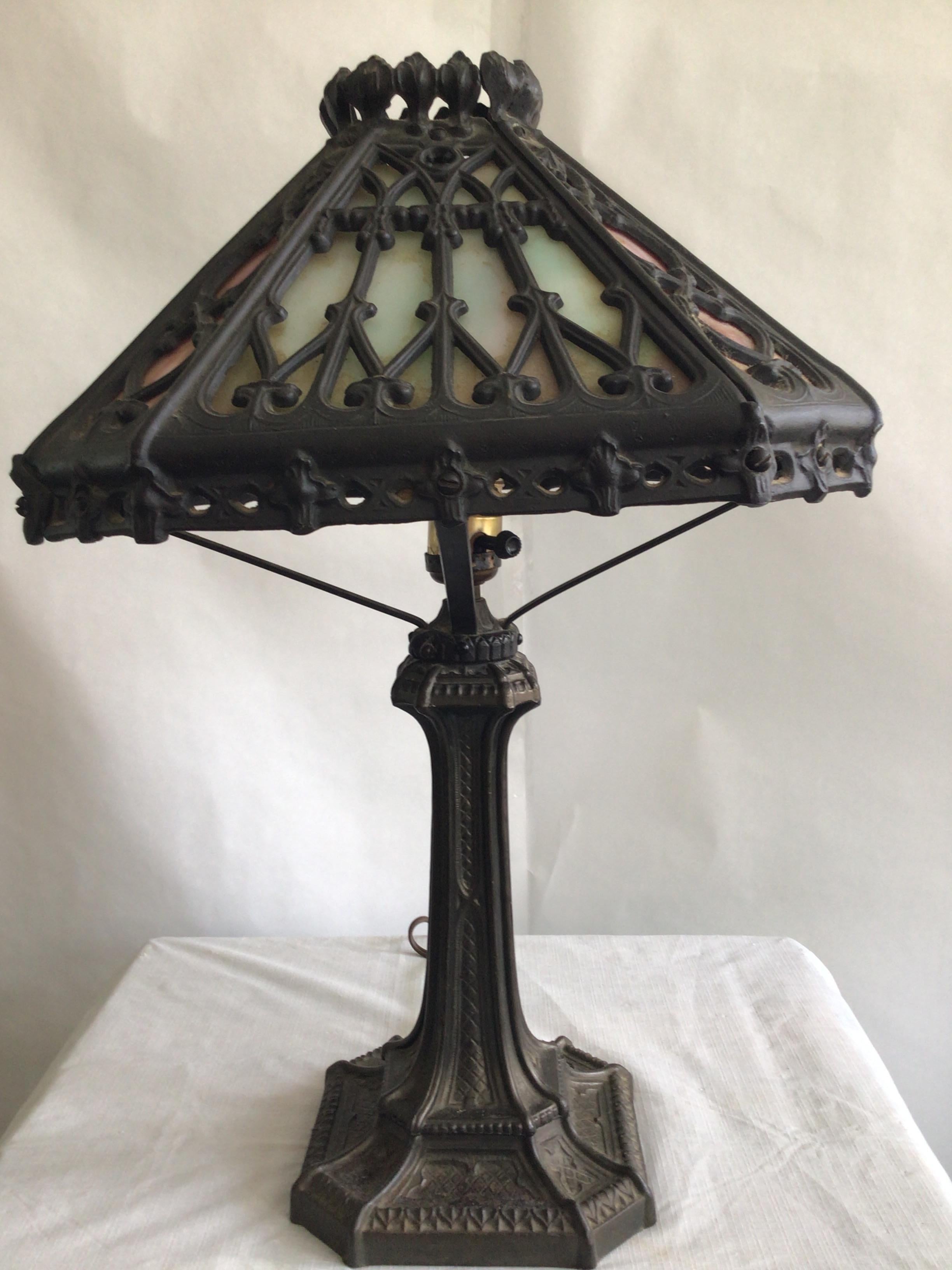 1920a Ornate Iron Leaded Glass Table Lamp
Height to top of shade
Mint greens and pink stained glass
Needs Rewiring
Shade Tilts a bit - needs adjustment