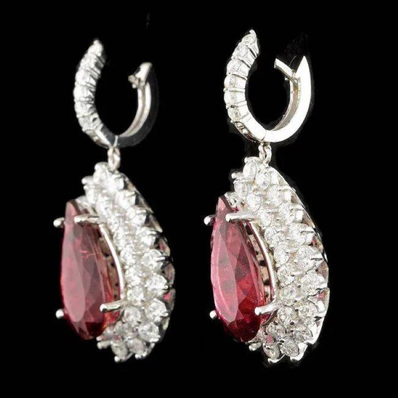 19.20ct Natural Tourmaline and Diamond 14K Solid White Gold Earrings

Total Natural Pear Tourmalines Weight: Approx. 13.90 Carats

Tourmaline Measures: 18 x 10 mm

Total Natural Round Cut White Diamonds Weight: 5.30 Carats (color G-H / Clarity