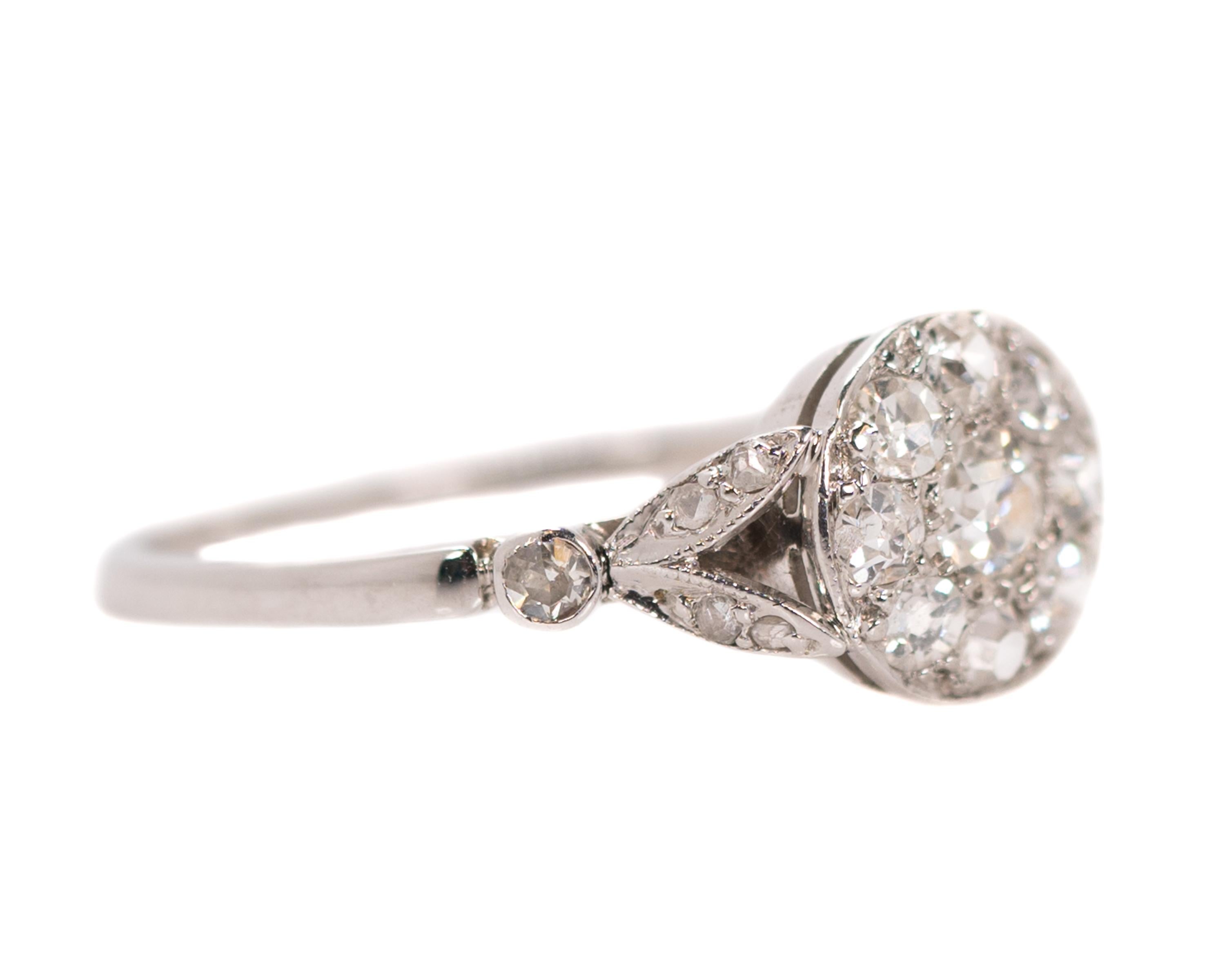 1920s Art Deco Diamond Cluster Ring - 18 Karat White gold, Old Mine Diamonds

Features:
0.60 carat total weight Old Mine Diamonds
18 karat White Gold setting
Open Gallery and Shoulders
Split shank shoulders

Finger to top of stone: 3
