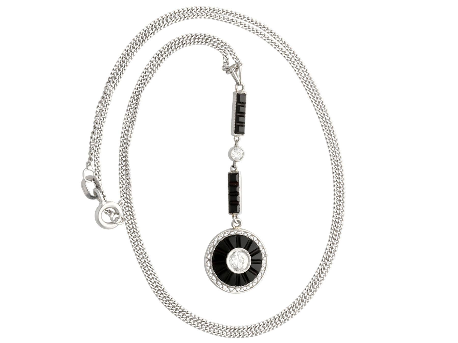 A fine and impressive antique 1.05 Carat onyx and 0.35 Carat diamond, platinum pendant; part of our diverse antique jewelry and estate jewelry collections.

This fine and impressive antique pendant has been crafted in platinum.

The drop style