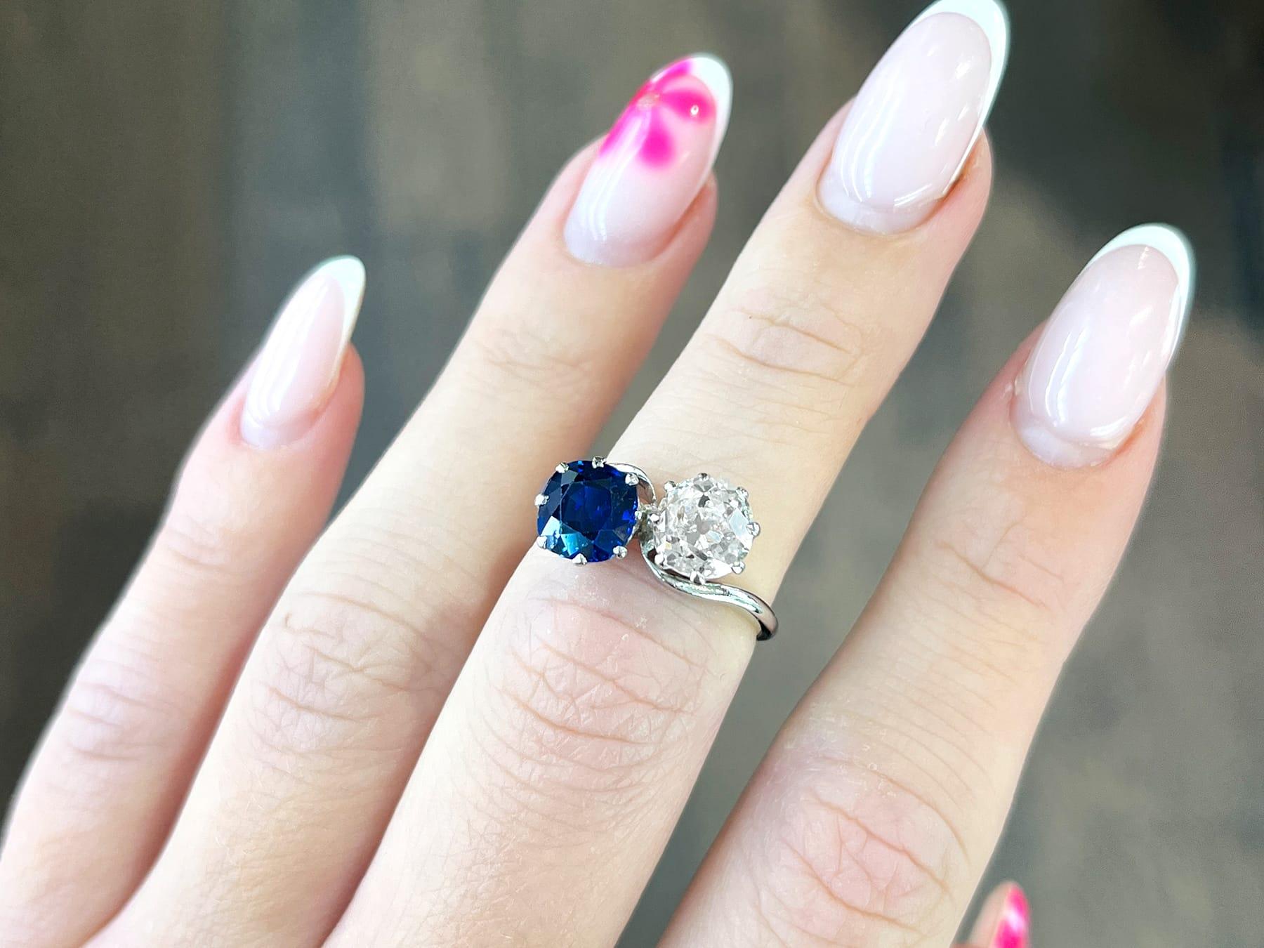 Old European Cut 1920s 1.45 Carat Diamond 1.58 Carat Sapphire Platinum Twist Ring For Sale