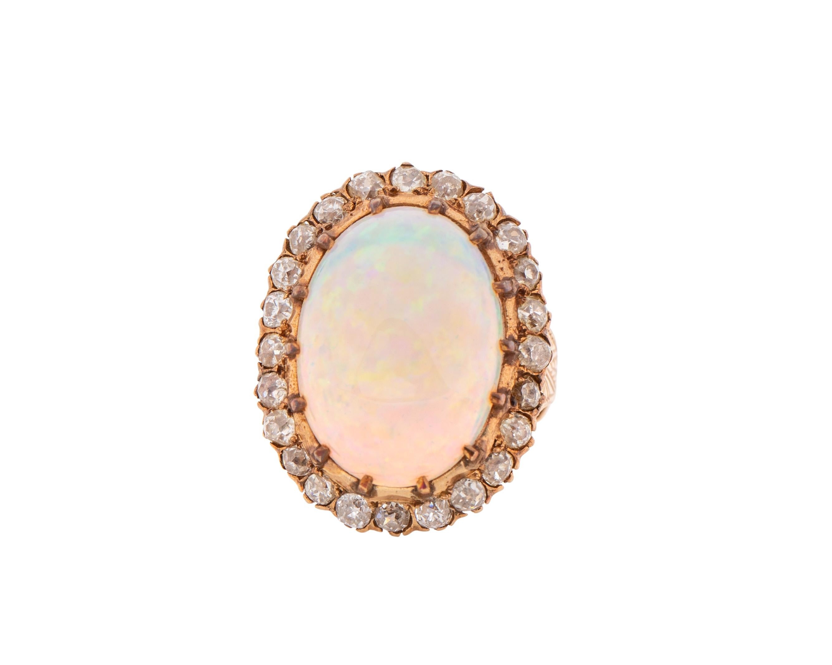 Item Details:
Metal type: 14 Karat Yellow Gold
Weight: 11.83 grams
Size: 6

Opal Details:
Cut: Cabochon 
Carat: 15 Carats

Diamond Details:
Cut: Old Miners
Carat: 1.5 Carat Total weight 
Color: G-J
Clarity: VS-I1

About the ring:
Stunning art deco