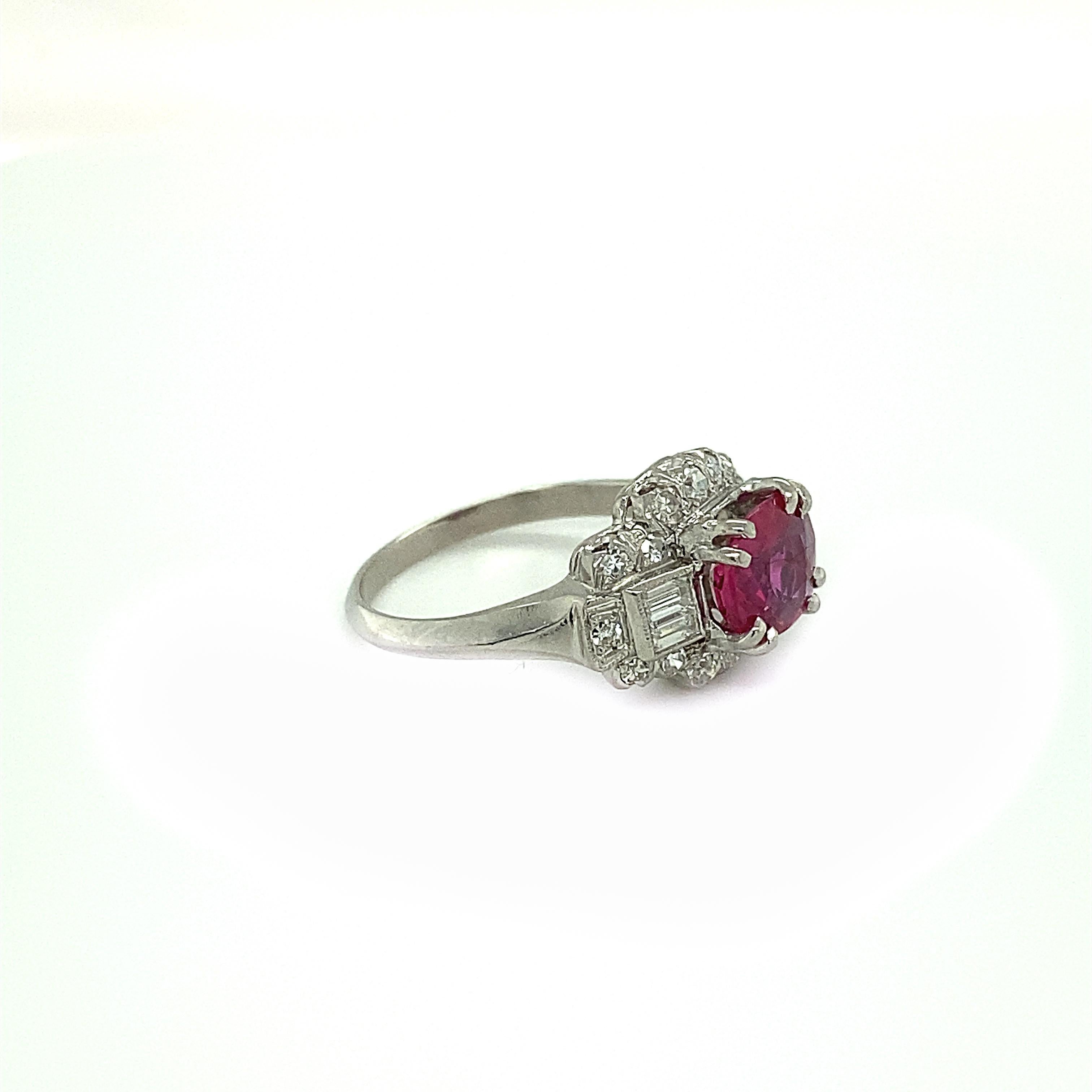 Item Details:
Metal Type: Platinum
Weight: 4 grams
Size: 6 (resizable)

Ruby Details:
Carat: 1.5 Carat Total
Heat Only Treatment

Diamond Details:
Cut: Single Cut and Baguettes
Carat: .4 carat total weight
Color: G
Clarity: VS

Top of Finger to Top