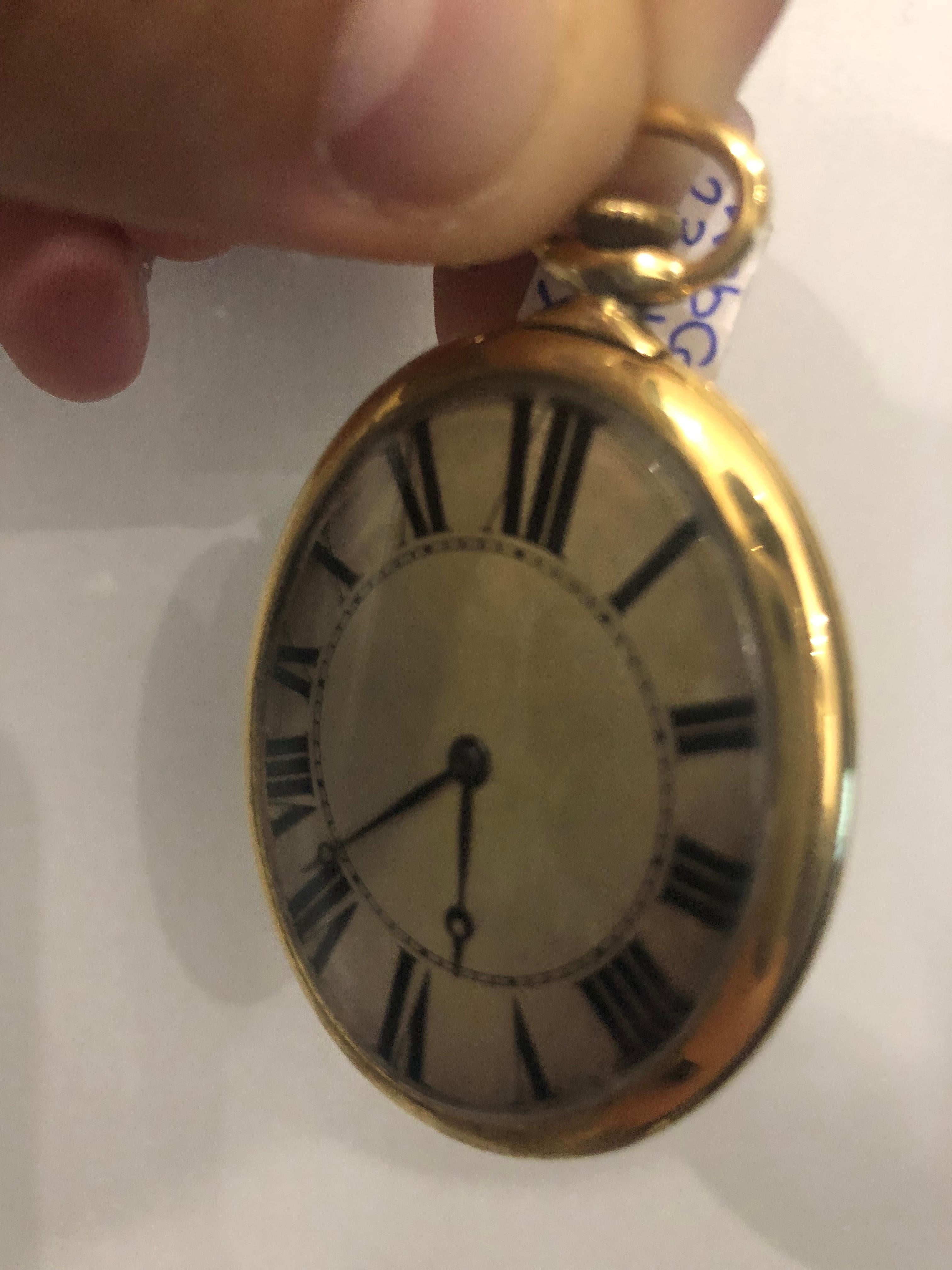 An 18k Yellow Gold Vintage Pocket Watch, silver dial with roman numerals and blue steel Breguet Moon Hands, a fixed polished 18k yellow gold bezel, a polished 18k yellow gold case, case back engraved with 
