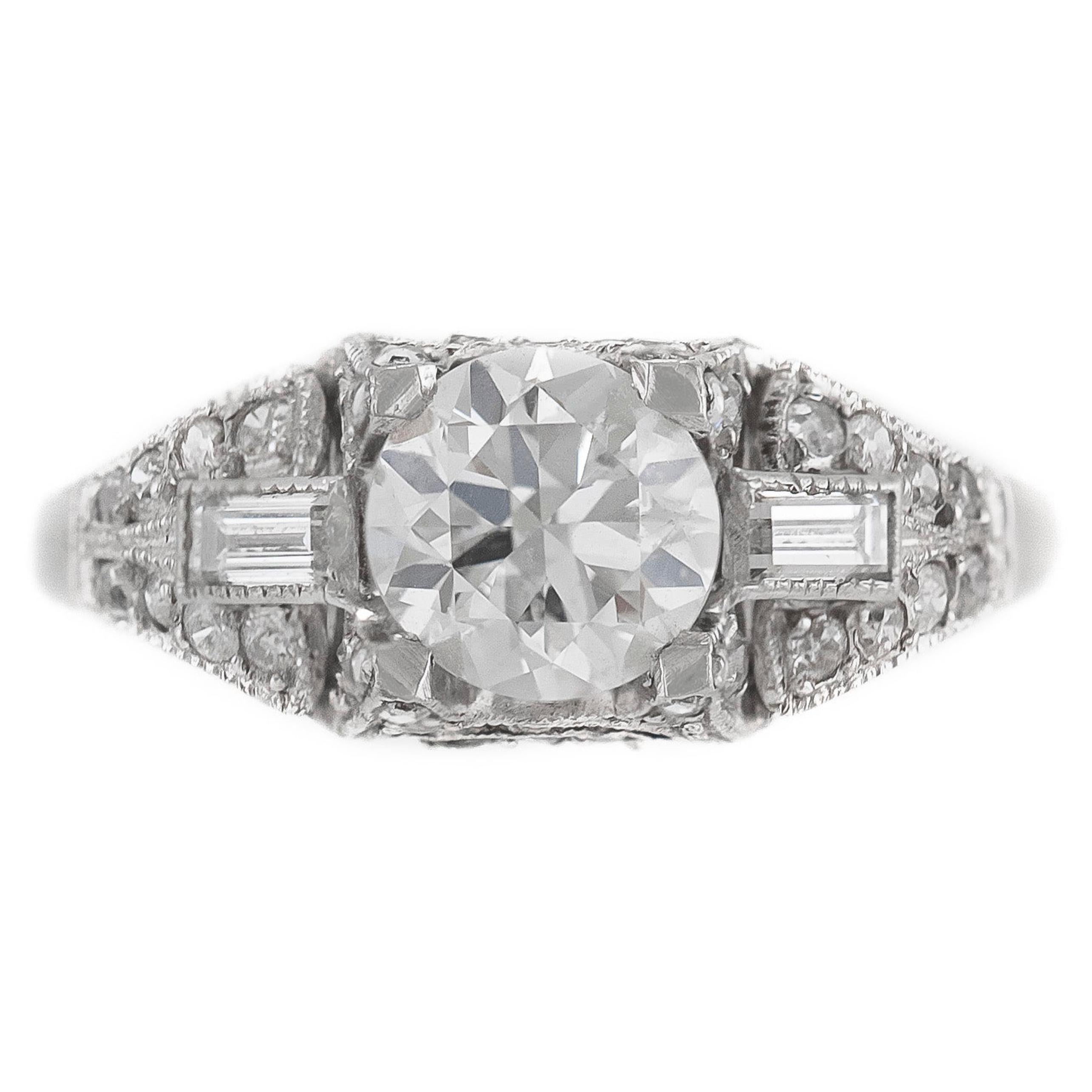 Bague de fiançailles en platine avec diamants taille ronde et émeraude des années 1920-1930