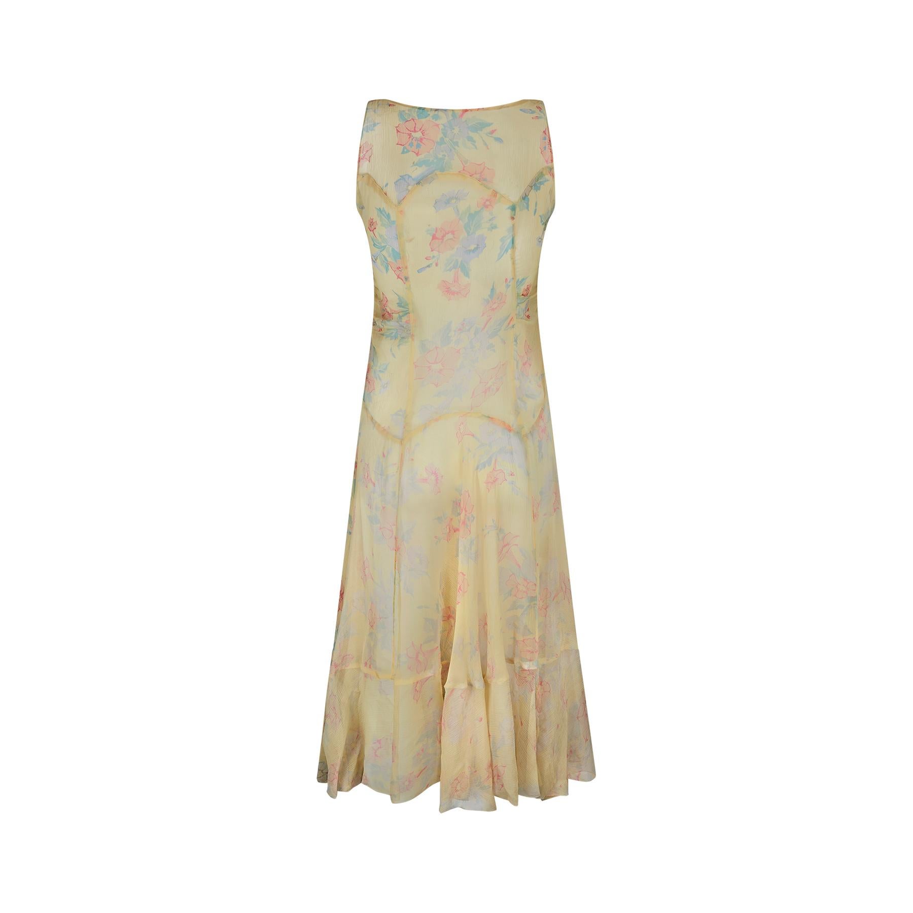 These original chiffon tea dresses are getting increasingly difficult to find in a wearable state and this dress is verging on exceptional antique condition. In beautiful pastel coloured hues of pale yellow, blues, greens and oranges and featuring