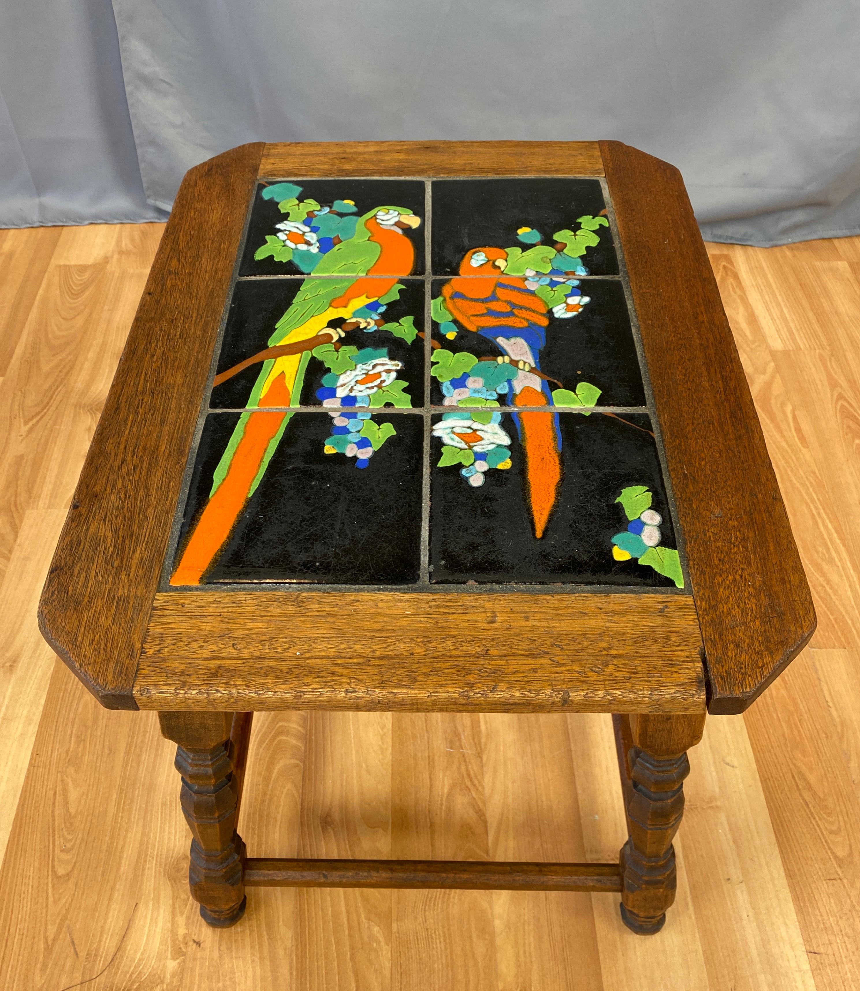 A 1920s-1930s Catalina tile top table with parrots, classic California Mission.
Six tiles with the base and trim in oak.