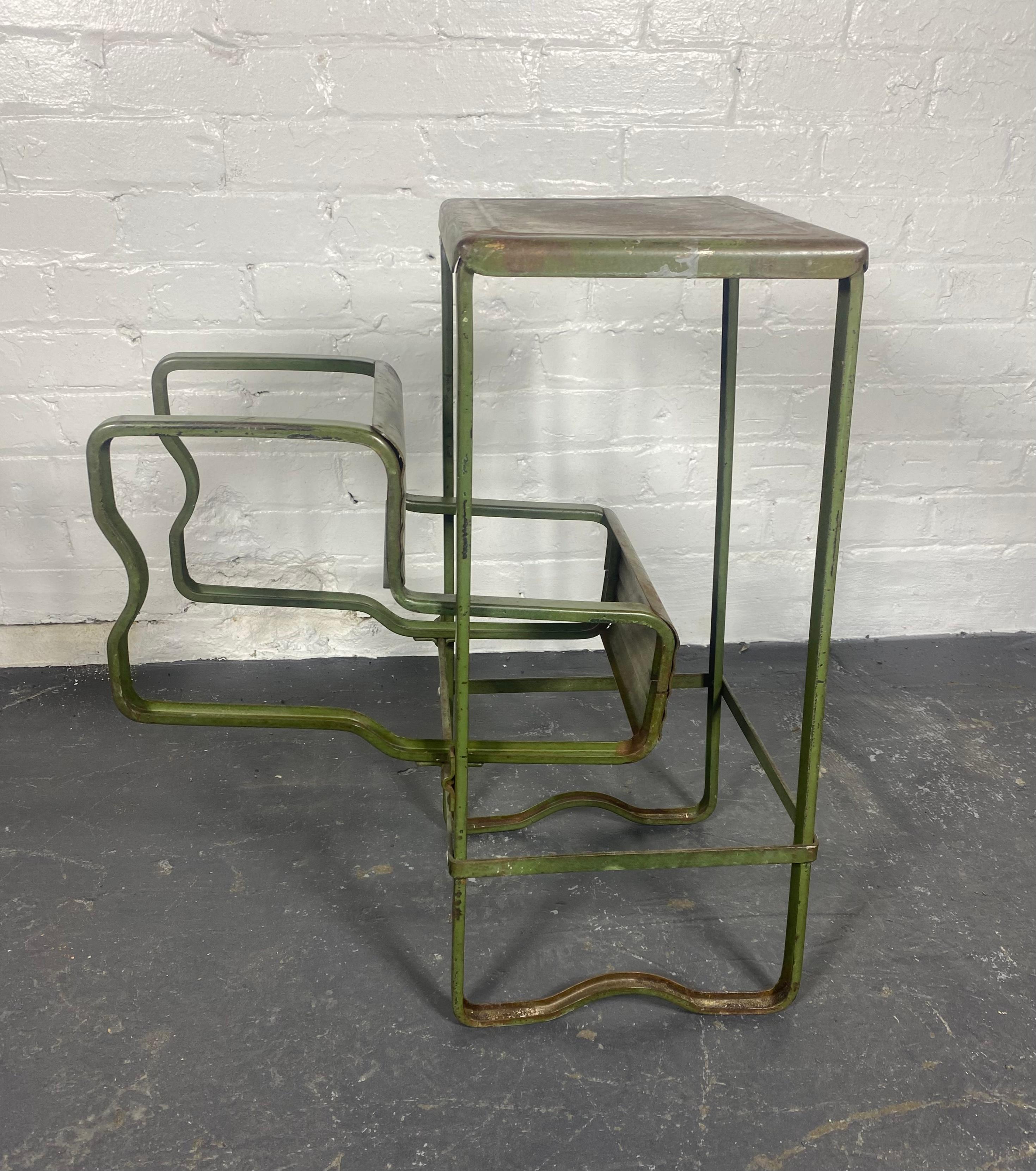 1920s -30s Industrial Pressed steel step stool, wonderful patina ,  old factory green paint  Amazing design. Piece of art , sculpture,,23