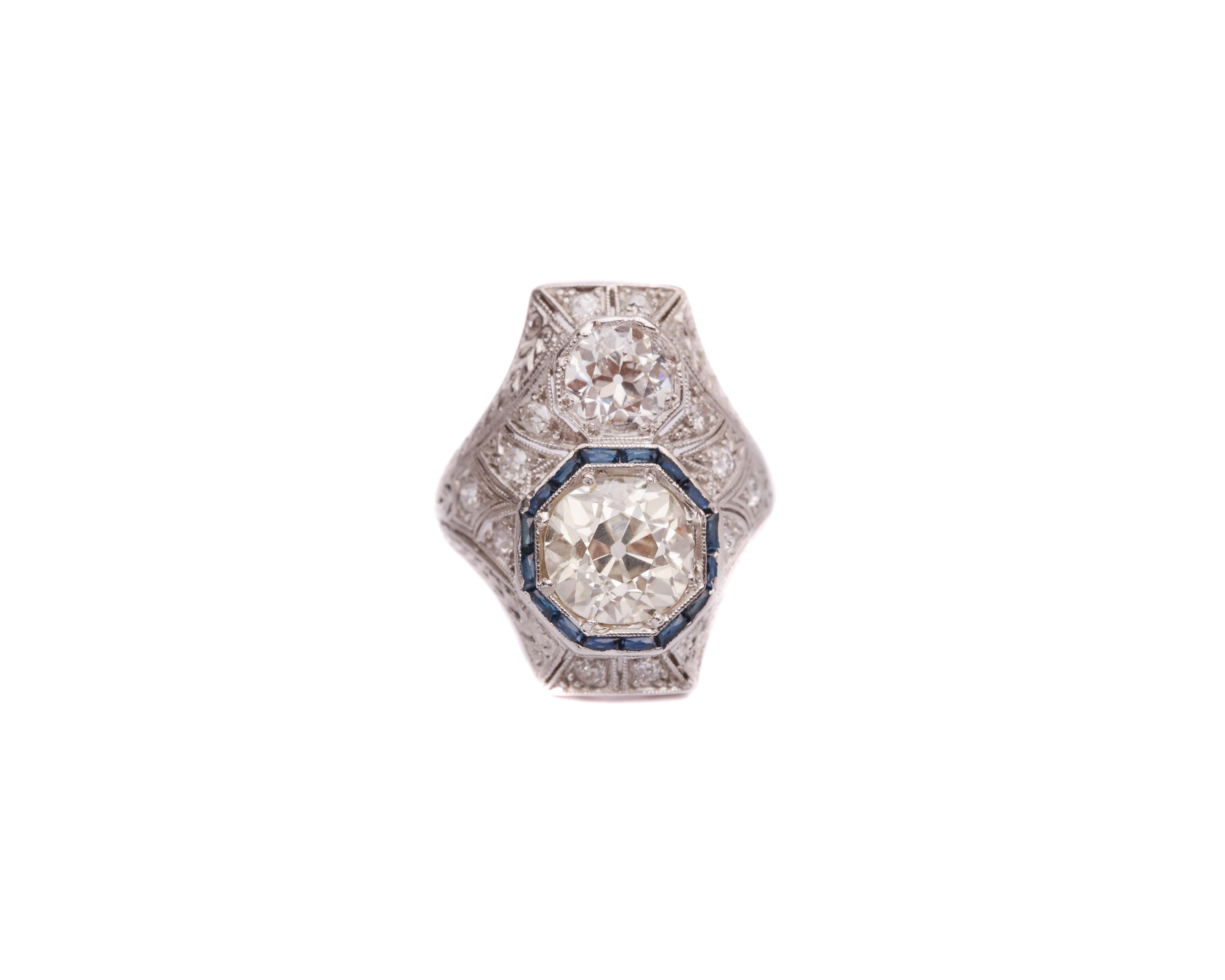 Item Details:
Metal type: Platinum
Weight: 6.7 grams
Size: 5 (resizable) 

Diamond Details:
Cut: Old Miner
Carat: 3 Carat
Color: M
Clarity: VS-SI

Diamond Details:
Cut: Old Miner
Carat: 1 Carat
Color: H
Clarity: VS

Accent Diamonds:
Cut: Single