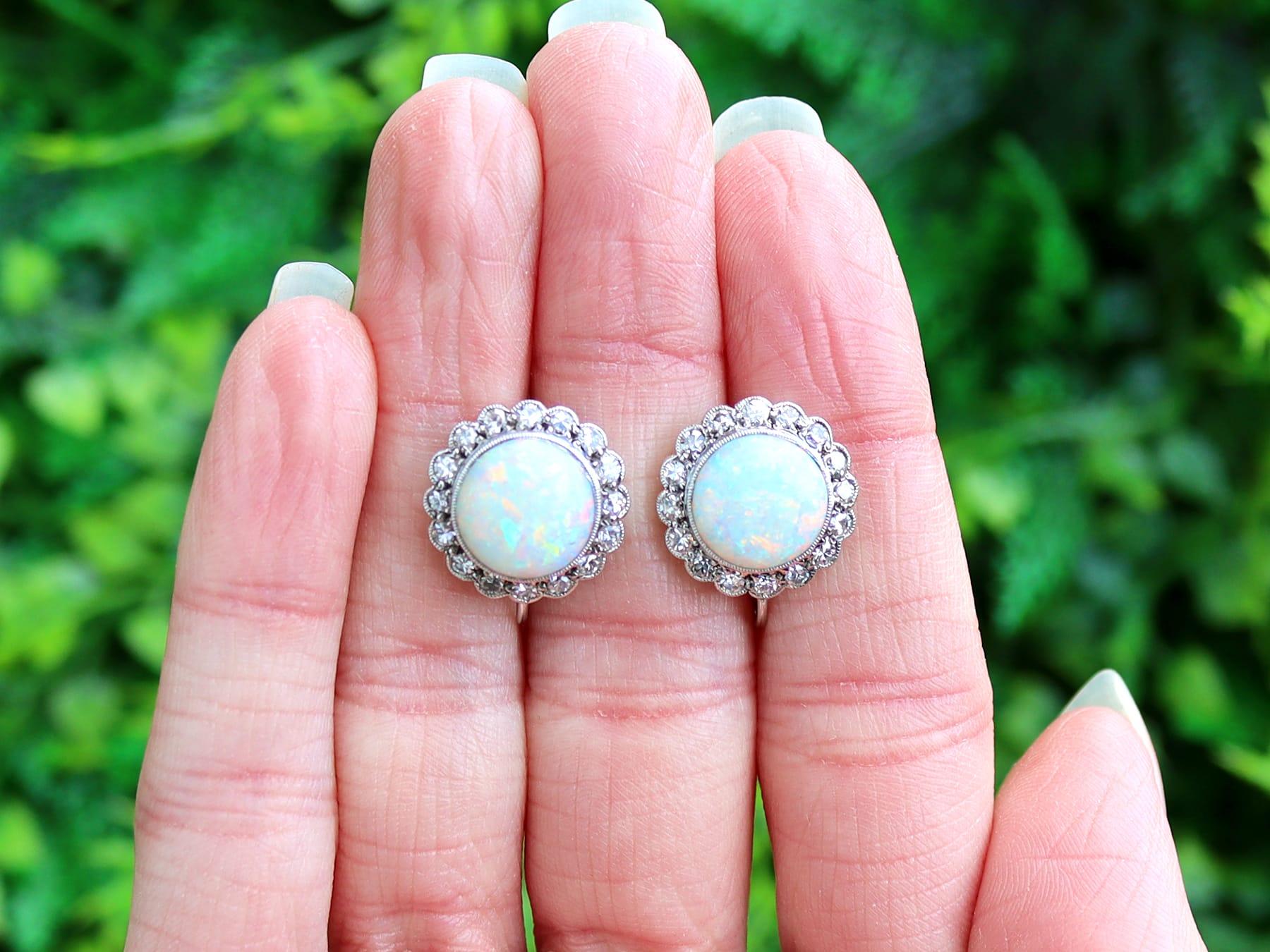 A stunning antique jewelry suite set with 8.18 carat white opal and 0.98 carat diamond, crafted in 9 karat white gold and platinum; part of our diverse antique estate jewelry collections.

This stunning, fine and impressive antique opal and diamond
