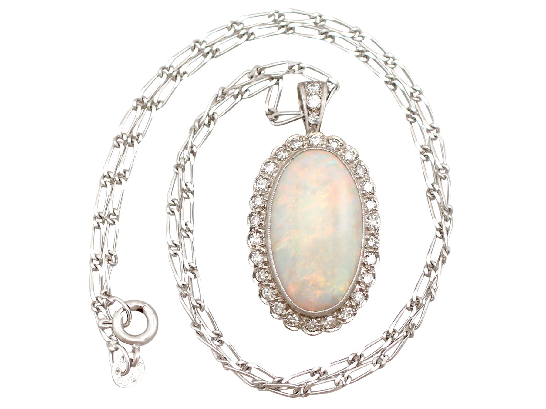 A stunning antique jewelry suite set with 8.18 carat white opal and 0.98 carat diamond, crafted in 9 karat white gold and platinum; part of our diverse antique estate jewelry collections.

This stunning, fine and impressive antique opal and diamond