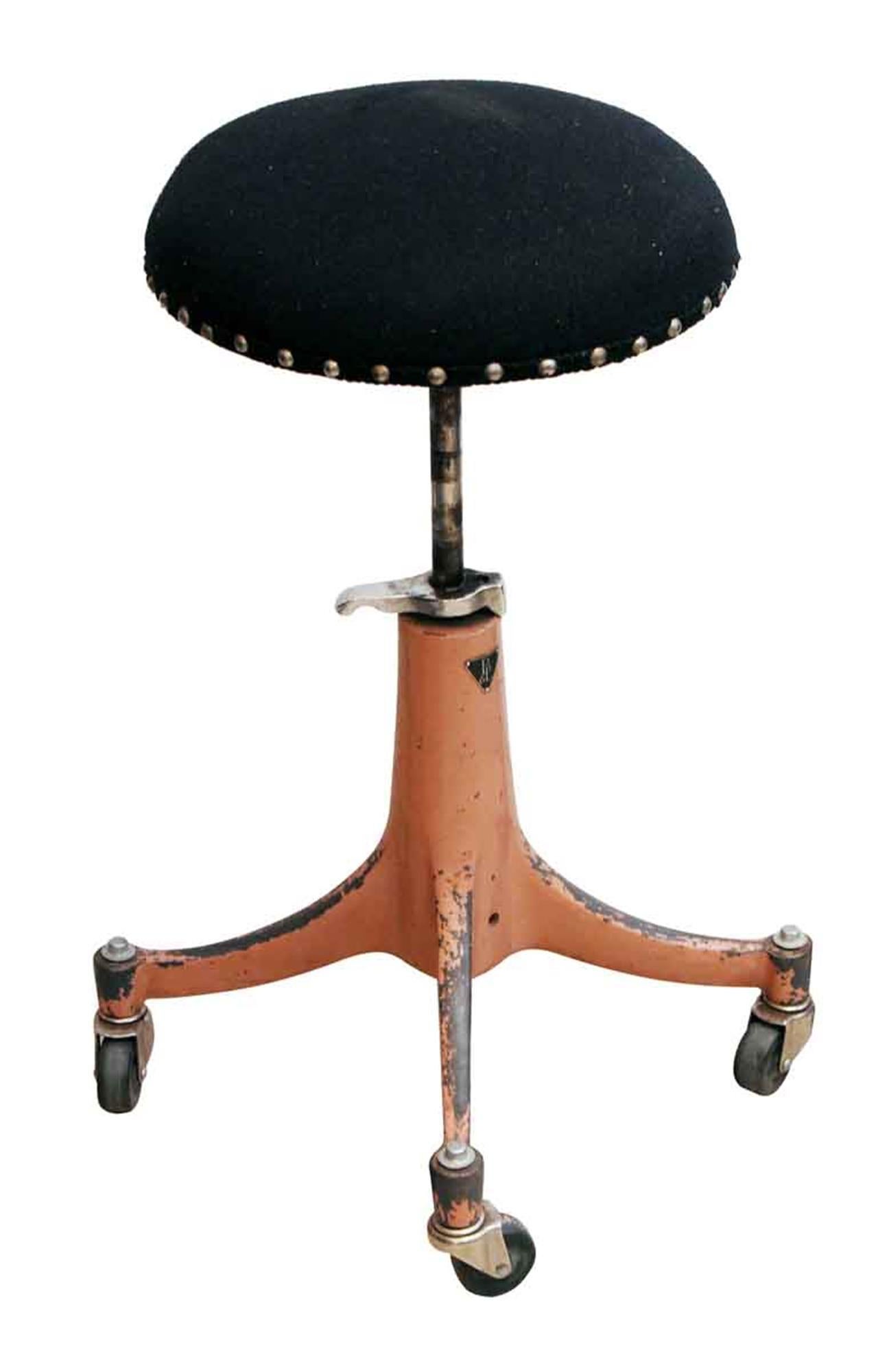 1920s adjustable doctor's stool with a black upholstered seat and pink painted base. Made by Bausch & Lomb. The wheels work well. This can be seen at our 5 East 16th St location on Union Square in Manhattan.