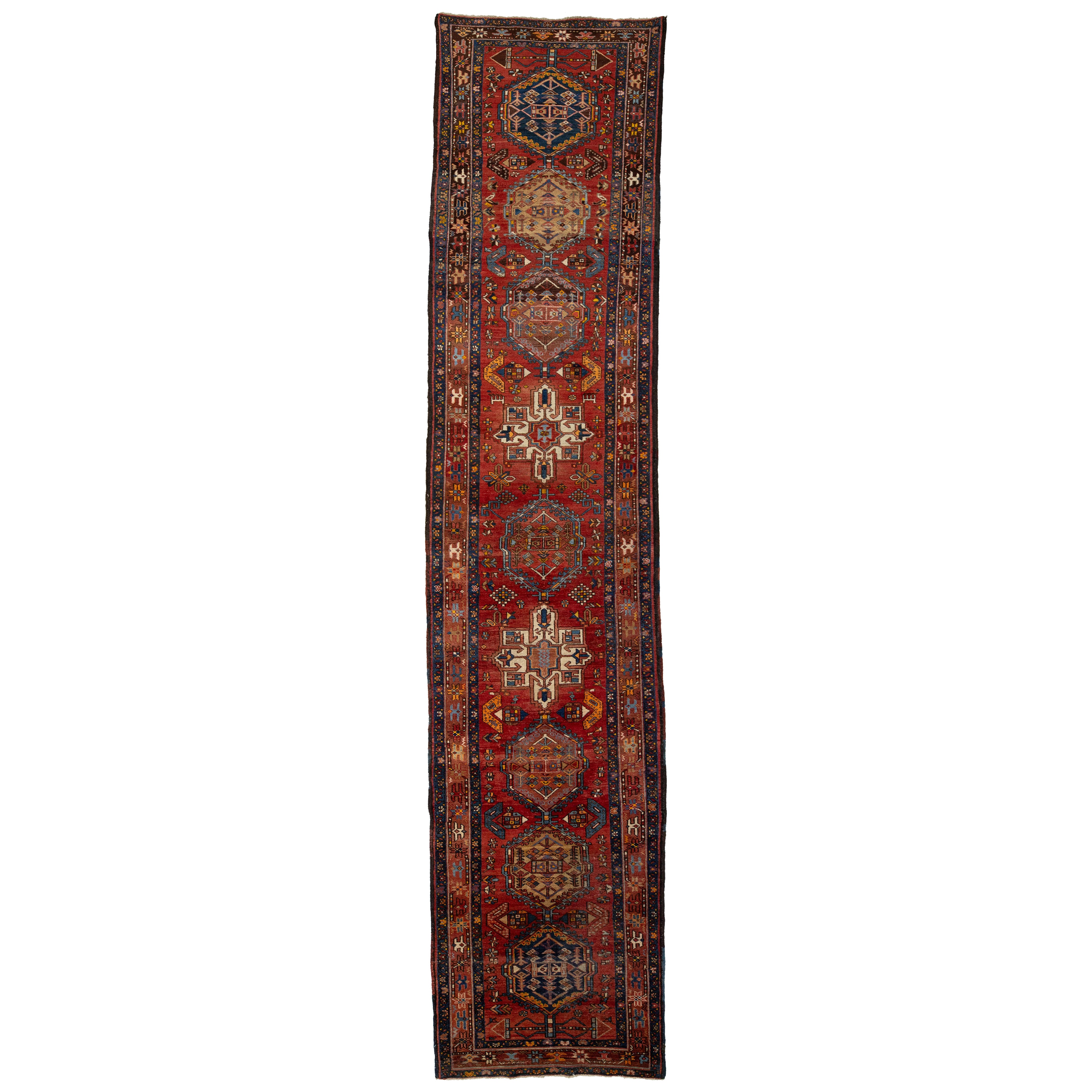 1920's Allover Designed Antique Heriz Long Wool Runner In Red For Sale