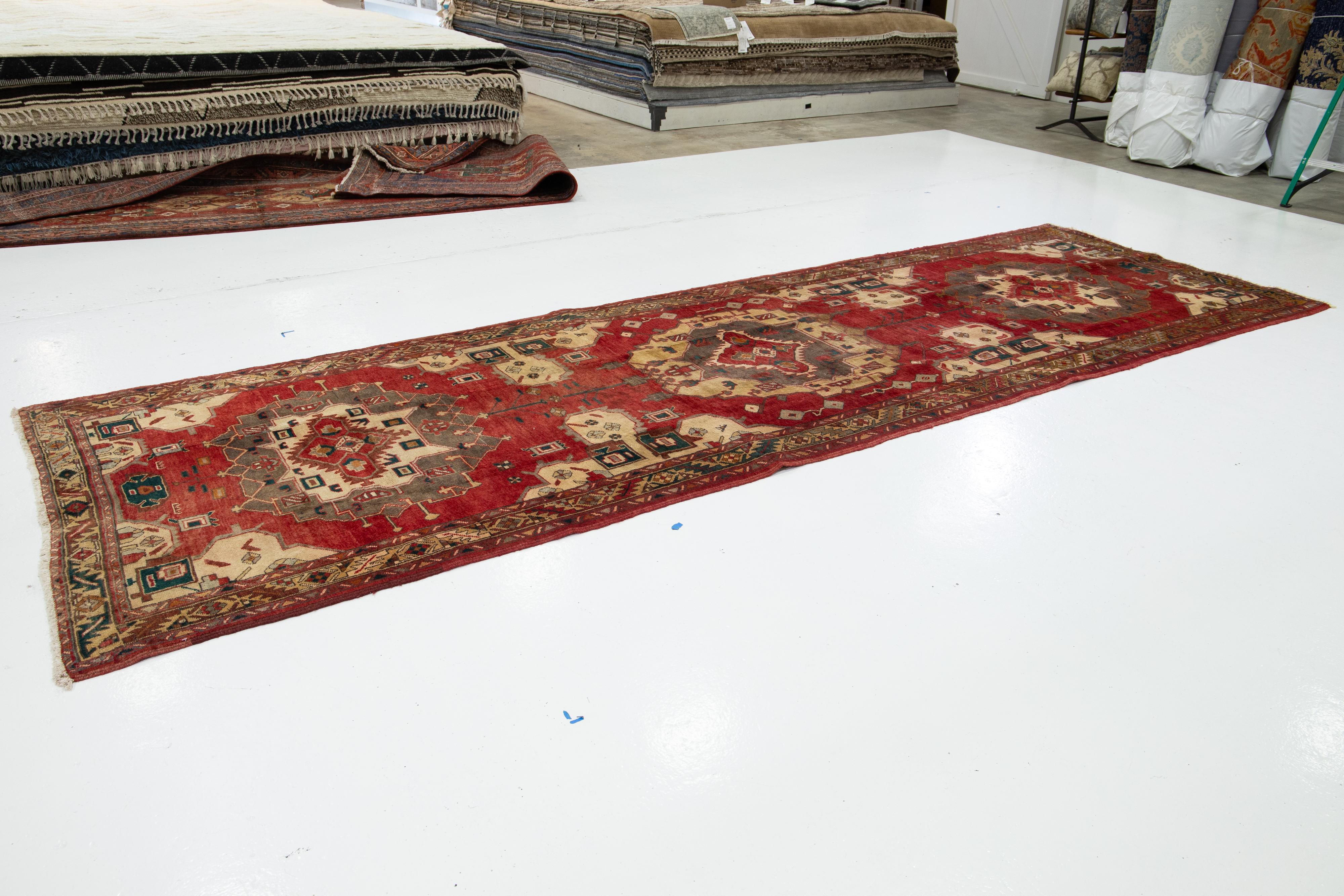 Persian 1940's Allover Designed Antique Heriz Wool Runner In Red For Sale