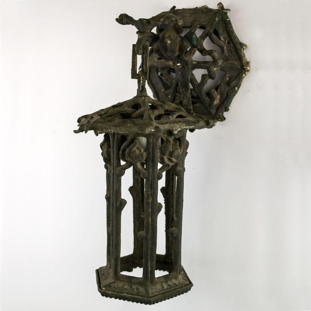 This 1920's hexagonal garden lantern is cast of iron and in the pattern of grape vine twigs. We have left the existing patina to speak to it's age.
It has been rewired by our Table M restoration shop.

Size: 7