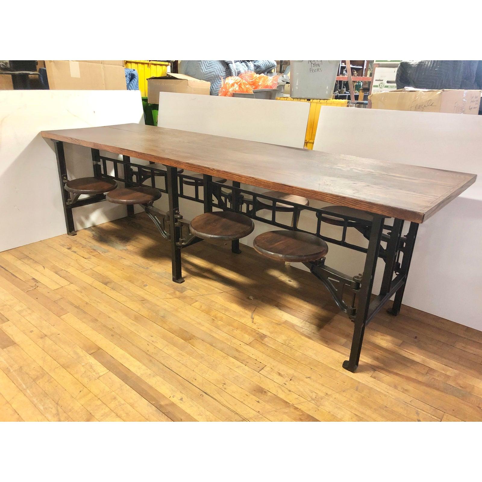 1920’s original American 8 swing out lunchroom table with cast iron base and wood top. Seat H 19”, diameter 13”, the widest
Distance from table 14” less.