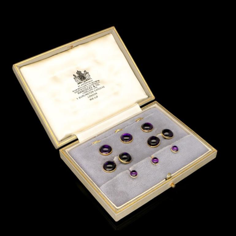 10 x amethyst cabochons estimated to weigh a combined total of approximately 24.35 Carats
Cufflinks 11mm diameter and 3cm long
Yellow gold
14.4 grams

A stylish and elegant gentleman's dress set circa 1925, the set comprised of a pair of cufflinks,
