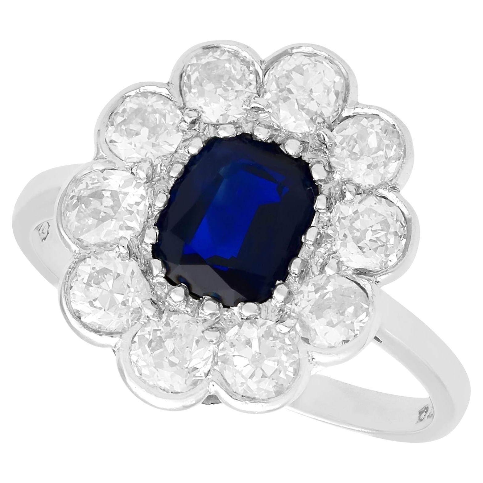 1920s Antique 1.07 Carat Sapphire and 1.54 Carat Diamond Platinum Cluster Ring For Sale