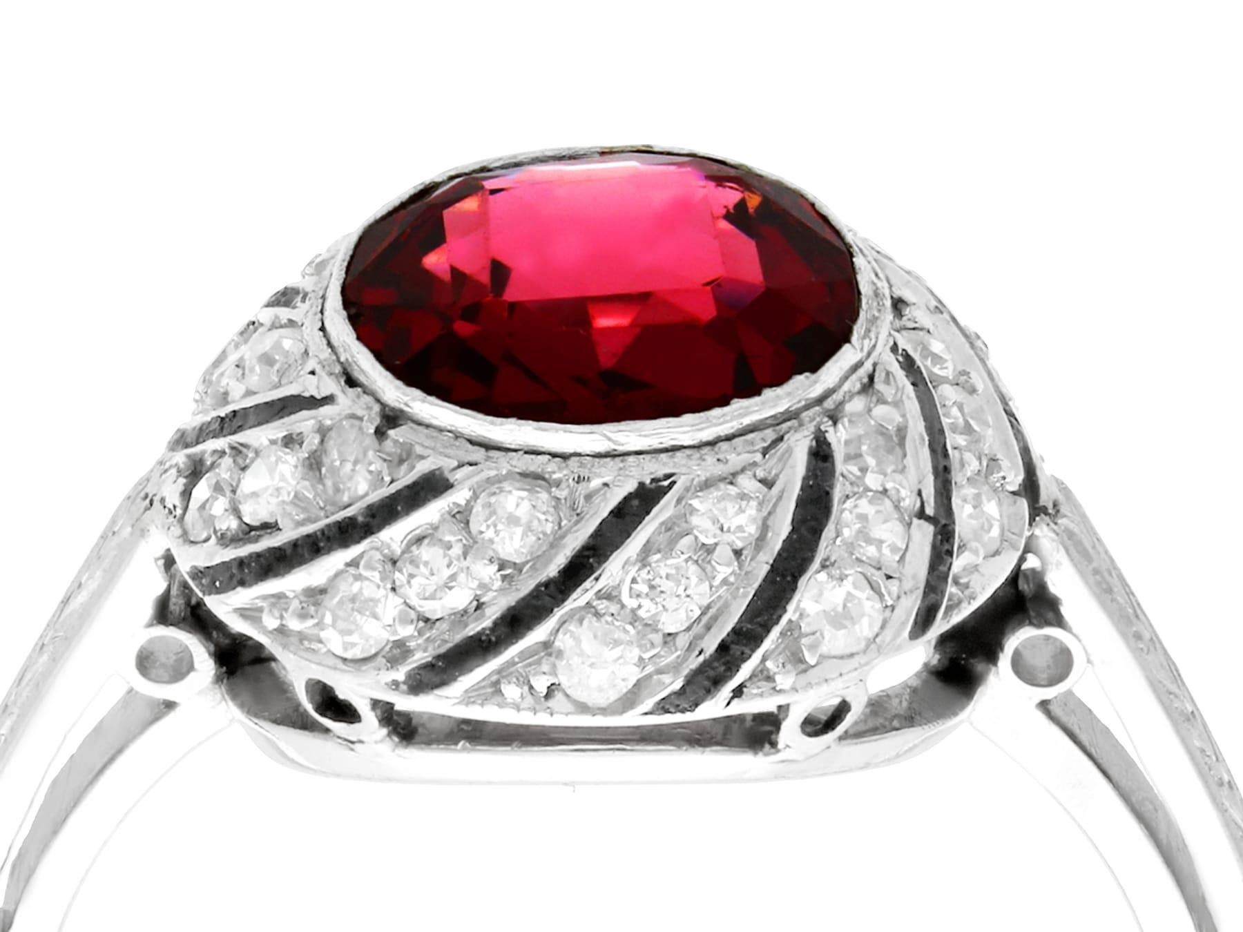 An impressive antique 1920s 2.30 carat garnet and 0.30 carat diamond, platinum dress ring; part of our diverse antique jewelry collections.

This fine and impressive antique ring has been crafted in platinum.

The circular domed setting displays a