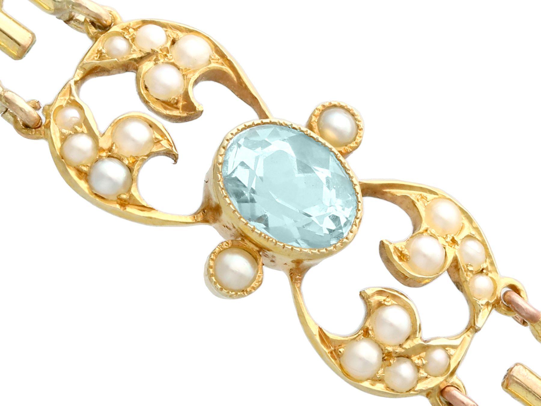 Oval Cut 1920s 2.55 Carat Aquamarine and Seed Pearl Yellow Gold Gate Bracelet For Sale