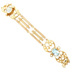 1920s Antique 2.55 Carat Aquamarine and Seed Pearl Yellow Gold Gate Bracelet