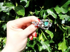1920s Antique 3.19 Carat Emerald 4.38 Carat Diamond and Pearl Gold Brooch