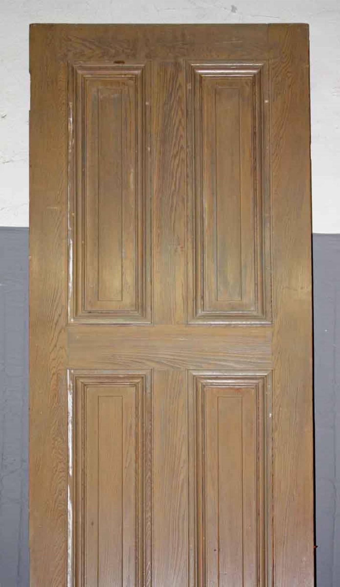 This exceptionally tall 1920s door features 6 panels. Various dings from being a 90+ year old door. This can be seen at our 400 Gilligan St location in Scranton. PA. Measures: 122.75 inches high x 27.5 inches wide.