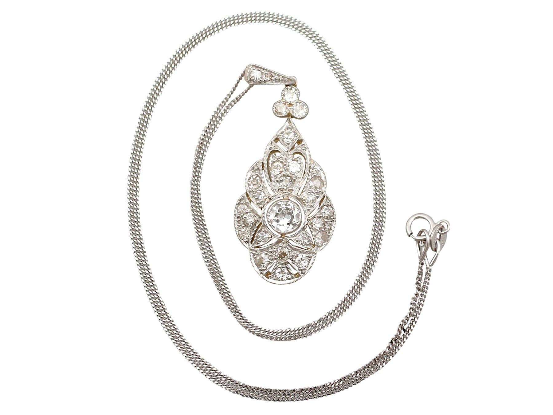 A stunning antique Art Deco 0.98 Ct diamond and 14 carat yellow gold, platinum set pendant and chain; part of our diverse antique jewellery and estate jewellery collections

This stunning, fine and impressive 1920's diamond pendant has been crafted