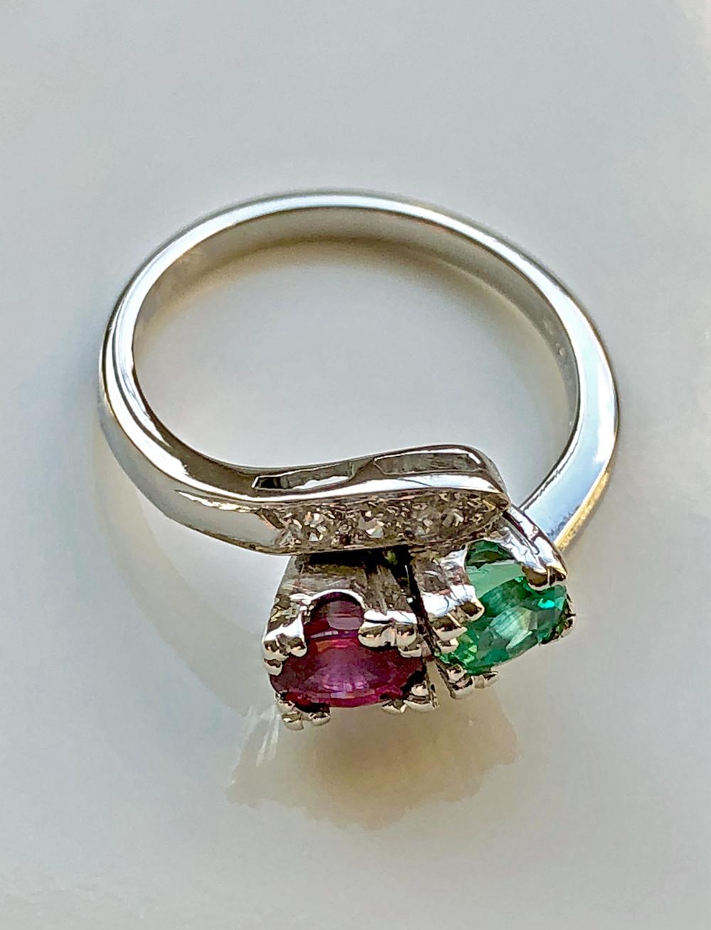 An Exclusive 1920s Antique Art Deco Emerald Ruby Diamond Platinum Engagement Ring
Primary Stone: 100% Natural Ruby, Emerald and Diamond
Shape or Cut: Oval Cut, Round Cut
Total Gemstone Weight: Approx. 1.50 Carat 
Average Color Gemstone: Best Color