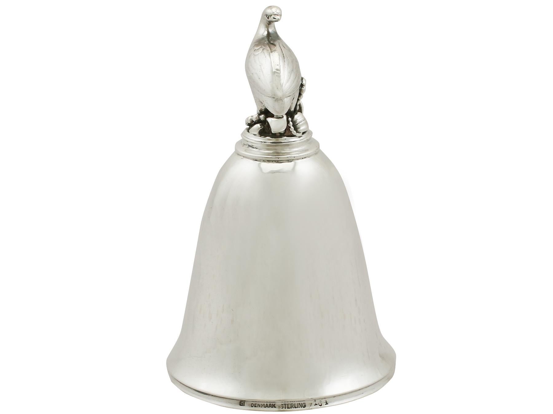 An exceptional, fine and impressive antique Danish sterling silver table bell in the Arts & Crafts style; an addition to our range of ornamental silverware.

This exceptional antique Danish sterling silver table bell has a plain bell shaped