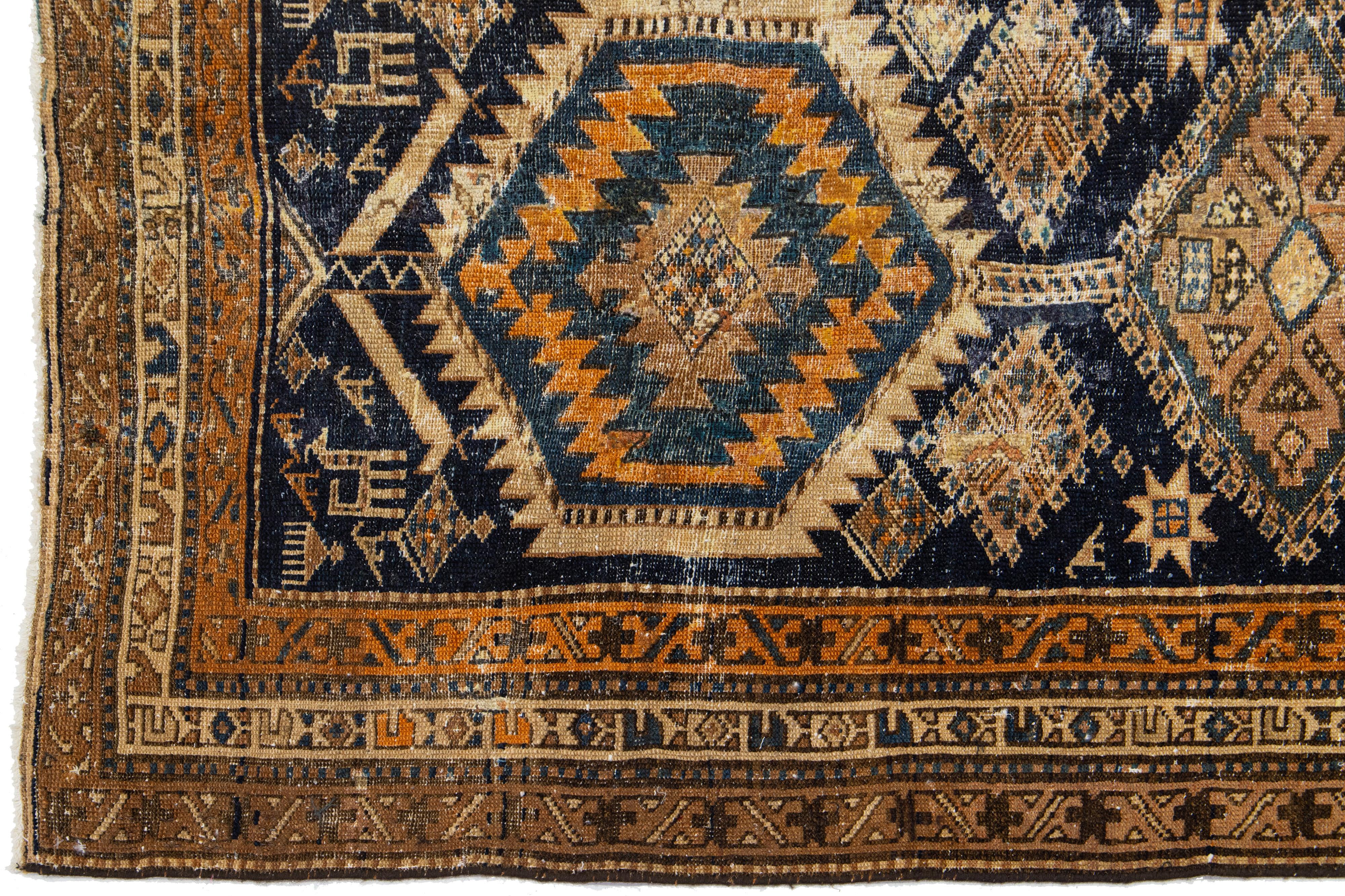 Hand-Knotted 1920s Antique Blue Heriz Wool Runner Handmade with Tribal Motif For Sale