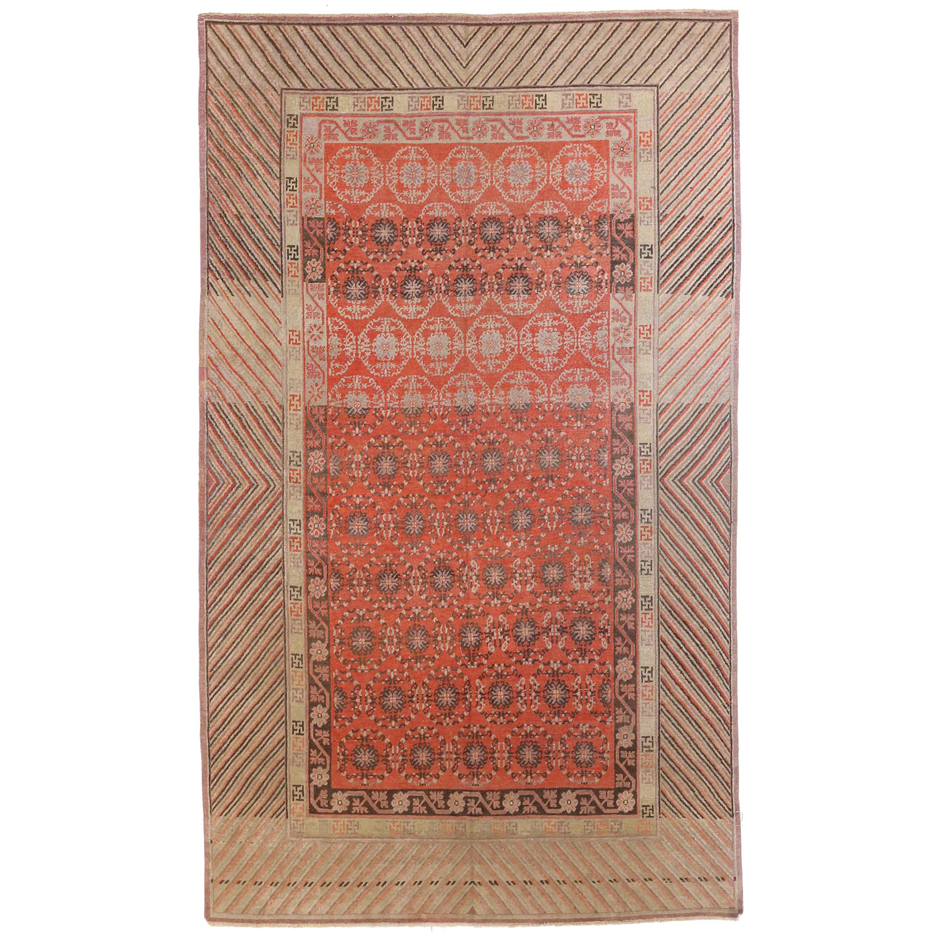 1920s Antique Central Asian Rug Khotan Design with Vibrant Geometric Border For Sale