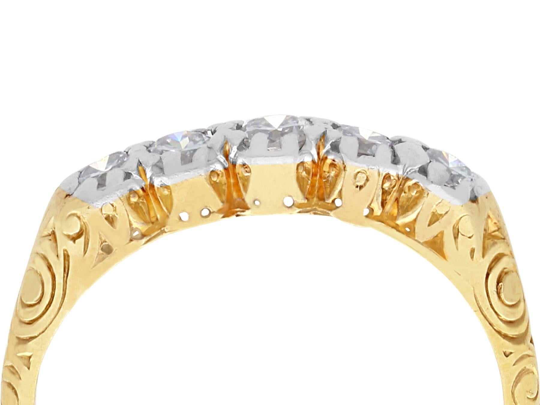 A fine and impressive antique 0.30 carat diamond and 14 karat yellow gold, 14 karat white gold set five stone ring; part of our antique jewelry and estate jewelry collections.

This impressive 1920s ring has been crafted in 14k yellow gold with a