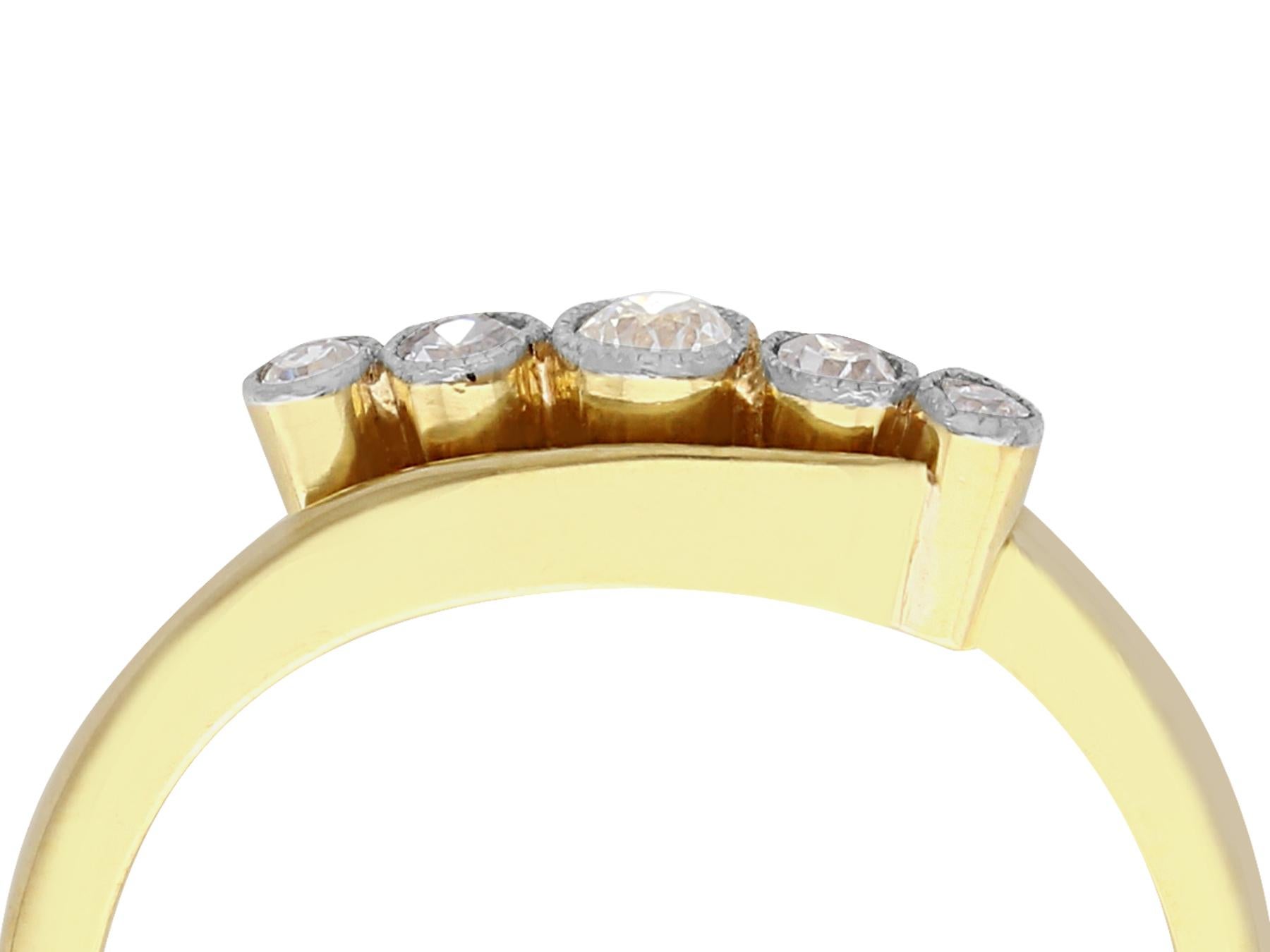 A very good antique 0.22 carat diamond and 18 karat yellow gold, platinum set five stone ring; part of our antique jewelry and estate jewelry collections.

This very good 1920s ring has been crafted in 18k yellow gold with a platinum setting.

The
