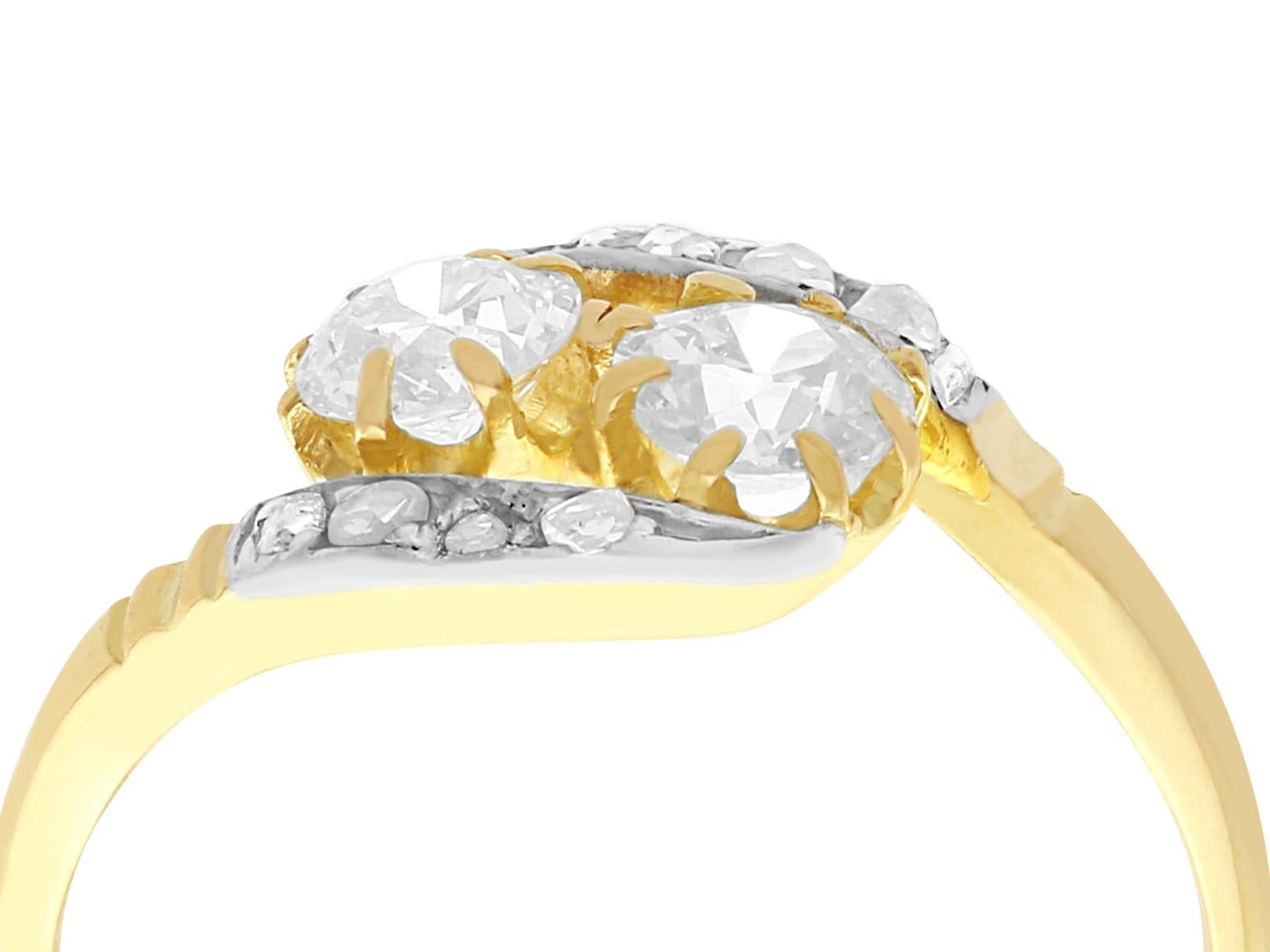 A fine and impressive antique 0.91 carat diamond and 18k yellow gold, silver set twist ring; an addition to our antique jewelry collection.

This impressive antique diamond twist ring has been crafted in 18k yellow gold with a silver setting.

The