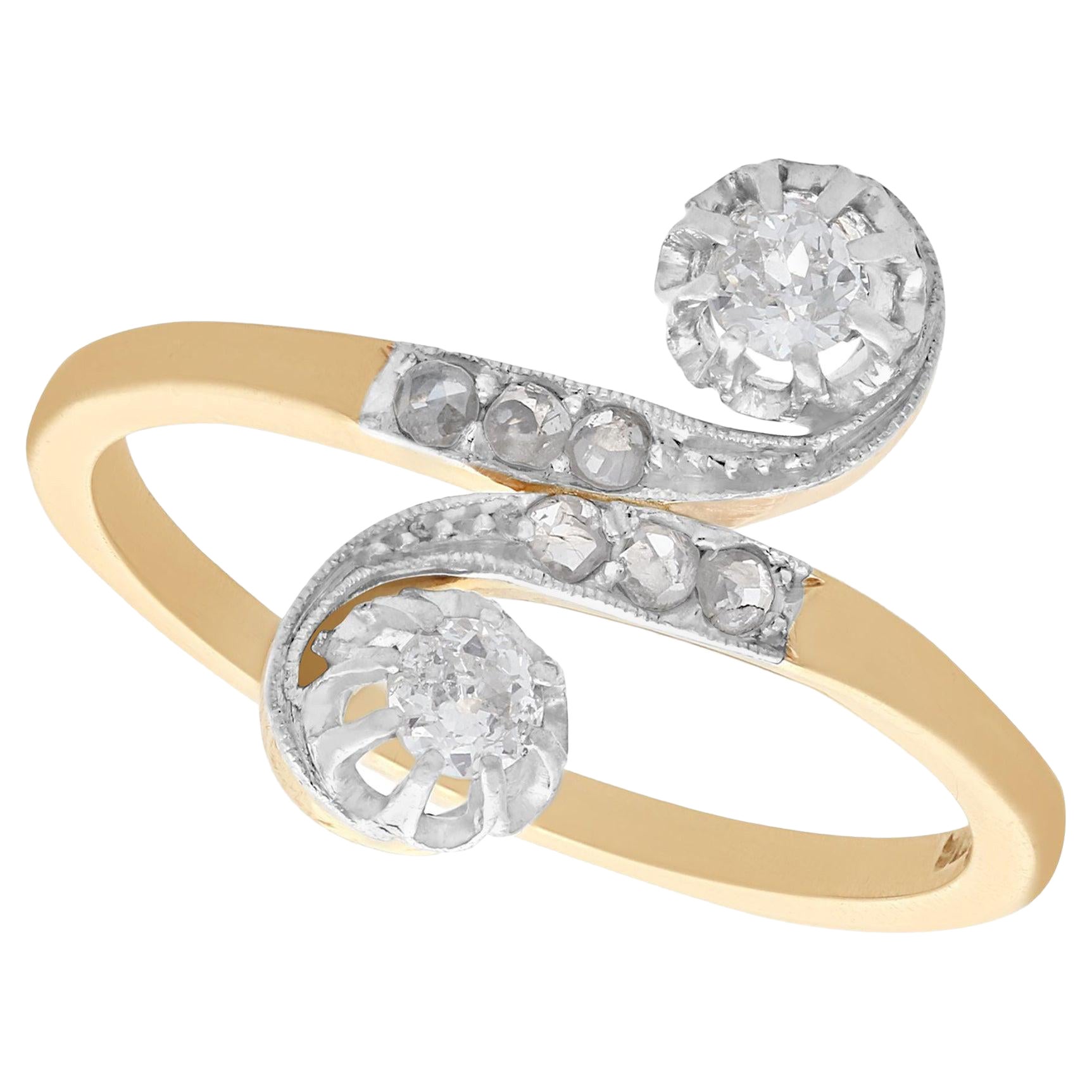 Bague tourbillonnante ancienne des années 1920 en or jaune et or blanc sertie de diamants