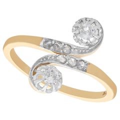 Bague tourbillonnante ancienne des années 1920 en or jaune et or blanc sertie de diamants