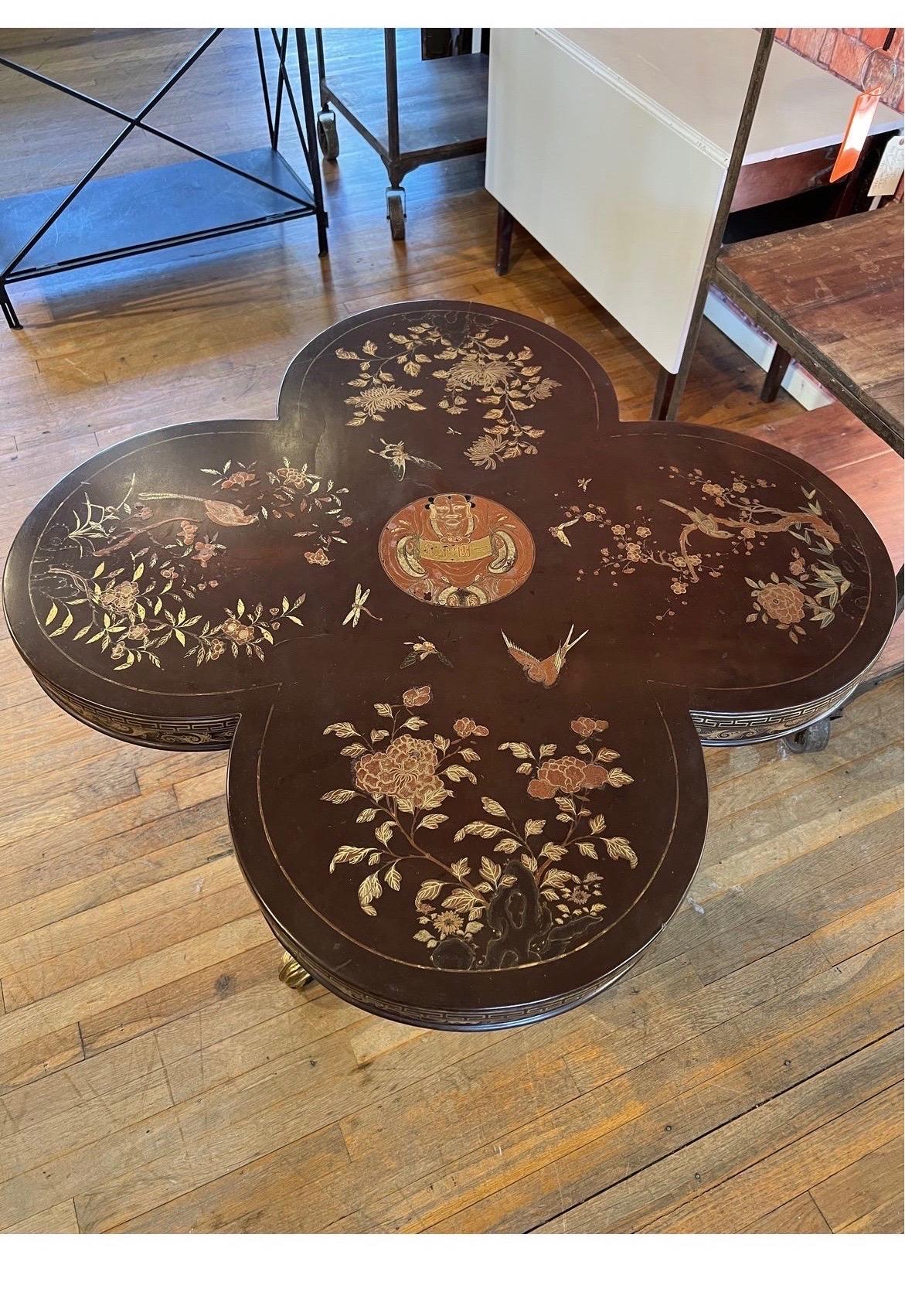 Stunning 4-leaf clover designed top with chinoiserie lacquer decoration, birds and floral to top and resting on a parcel gilt and ebonzied center table.
Very spectacular and rare form with fine decoration.