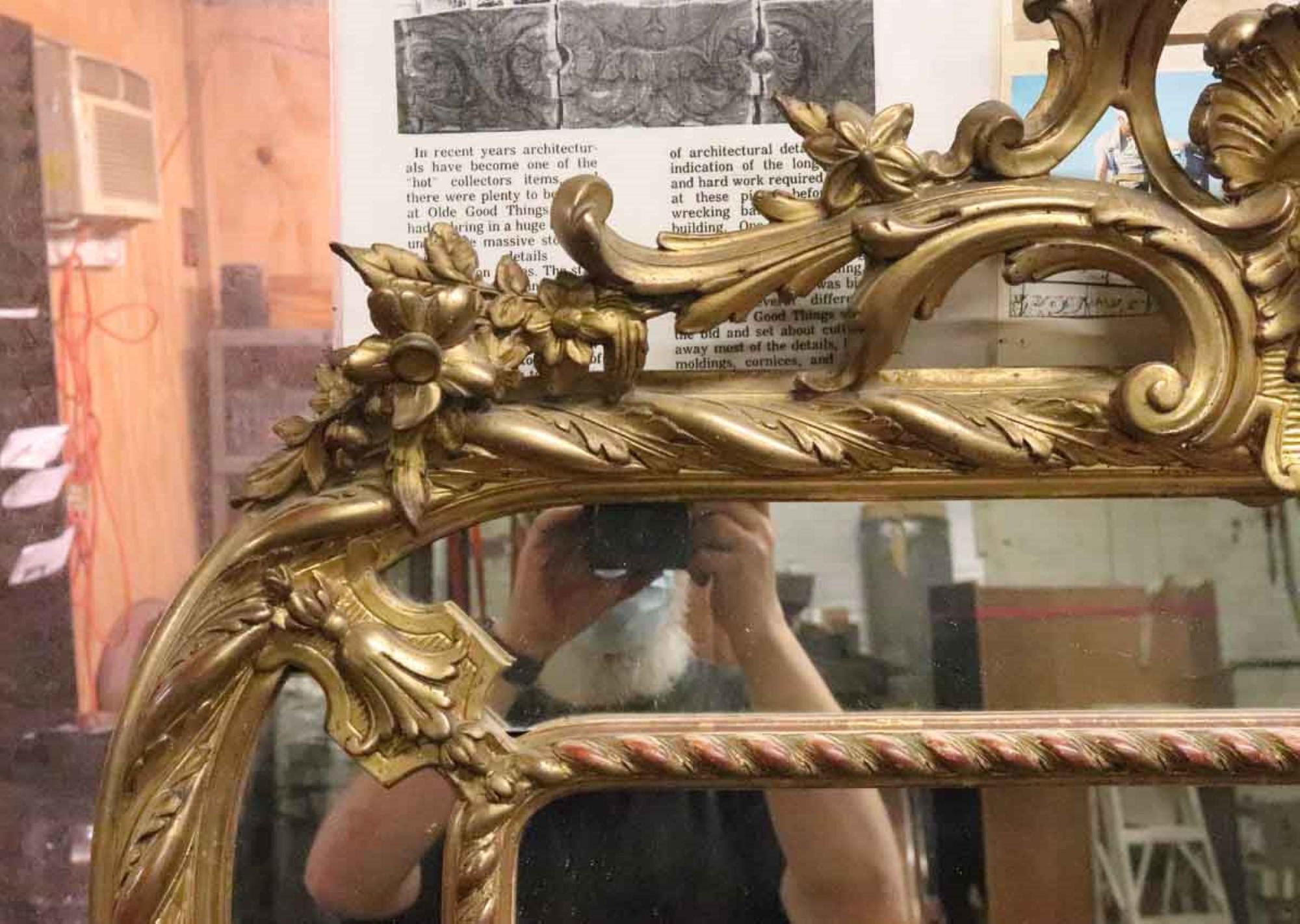 1920s Antique Gilded French Carved Wood Wall Mirror and Floral Detailing In Good Condition In New York, NY