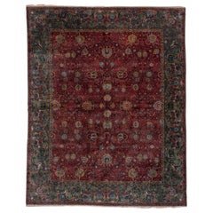 Tapis indien ancien de Lahore des années 1920, terrain bourgogne sur toute sa surface, bordures vert foncé