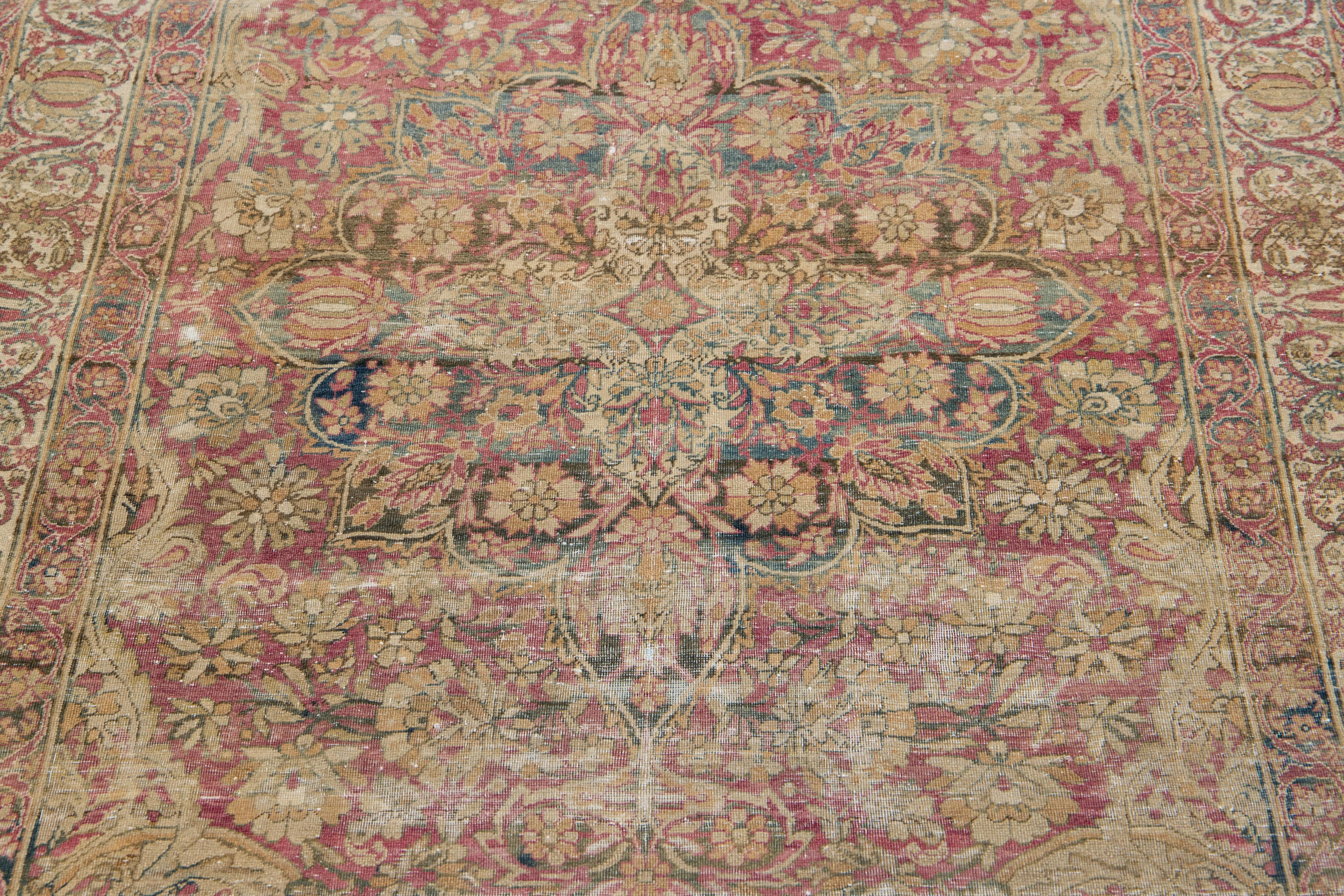 1920s Antique Kerman Handmade Wool Rug With Floral Medallion In Red In Good Condition For Sale In Norwalk, CT