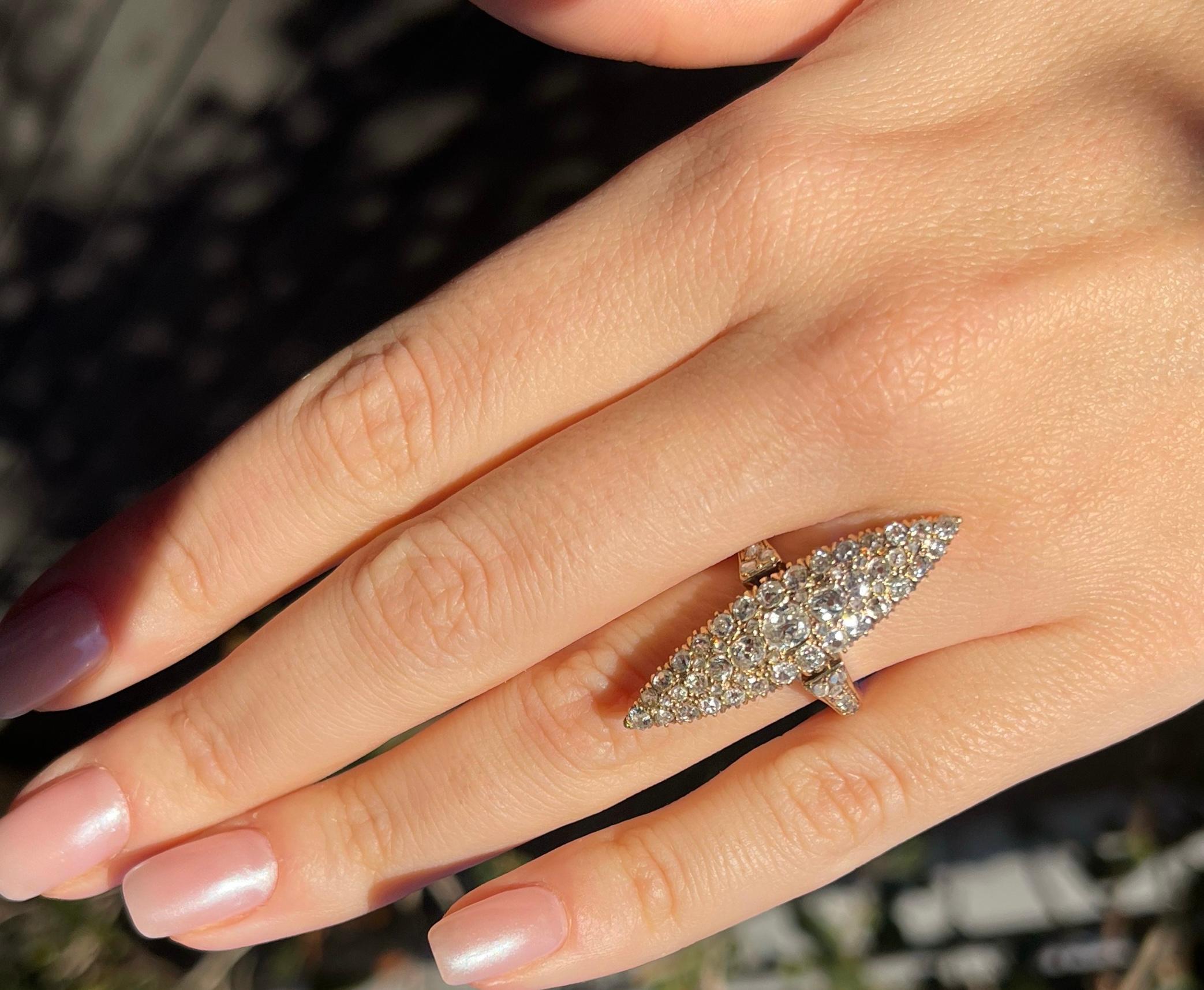 This antique ring is from the 1920s and features a marquise shape that is made of 18 karat yellow gold and a mix of rose-cut and old miner's diamonds, the light and the shining of these diamonds make this ring an incredible attire to any