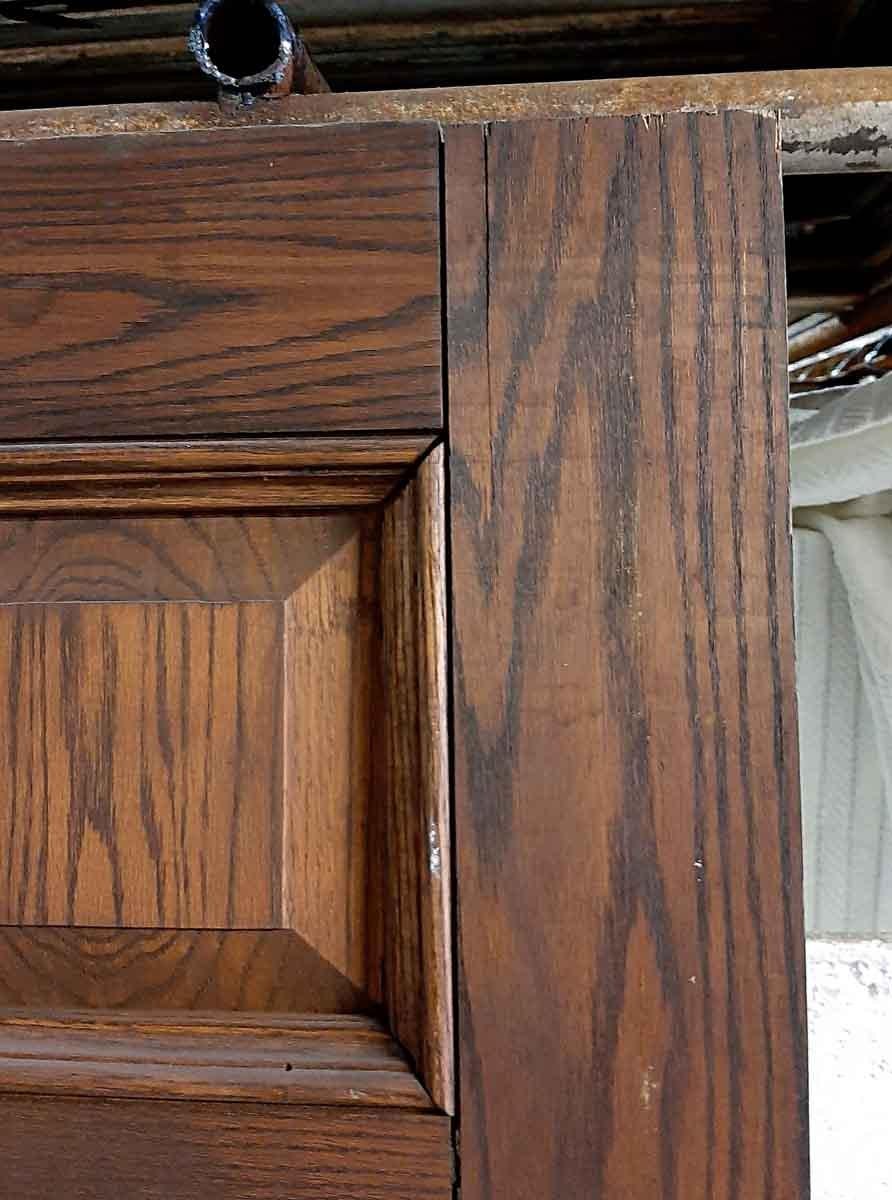 From a 1920s brownstone on East 93rd St and Fifth Ave. Tall oak door with eight panels done in a dark tone. No hardware is included. Measures: 108 inches H x 36 inches W.