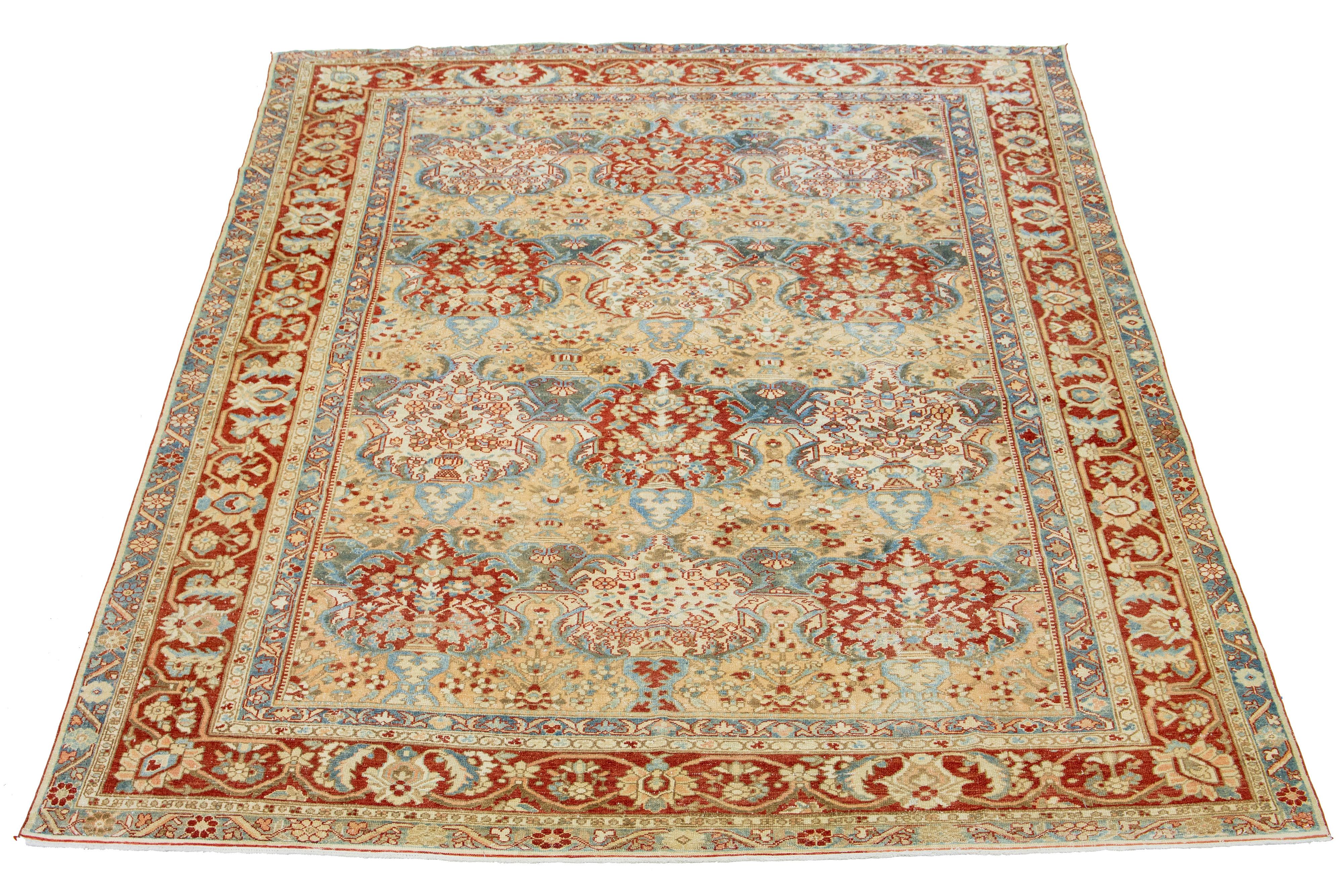 This is a beautiful antique Bakhtiari hand-knotted wool rug with a tan-colored field. This Persian piece features a classic multi-floral pattern in blue, peach, and red-rust hues.

This rug measures 10'9