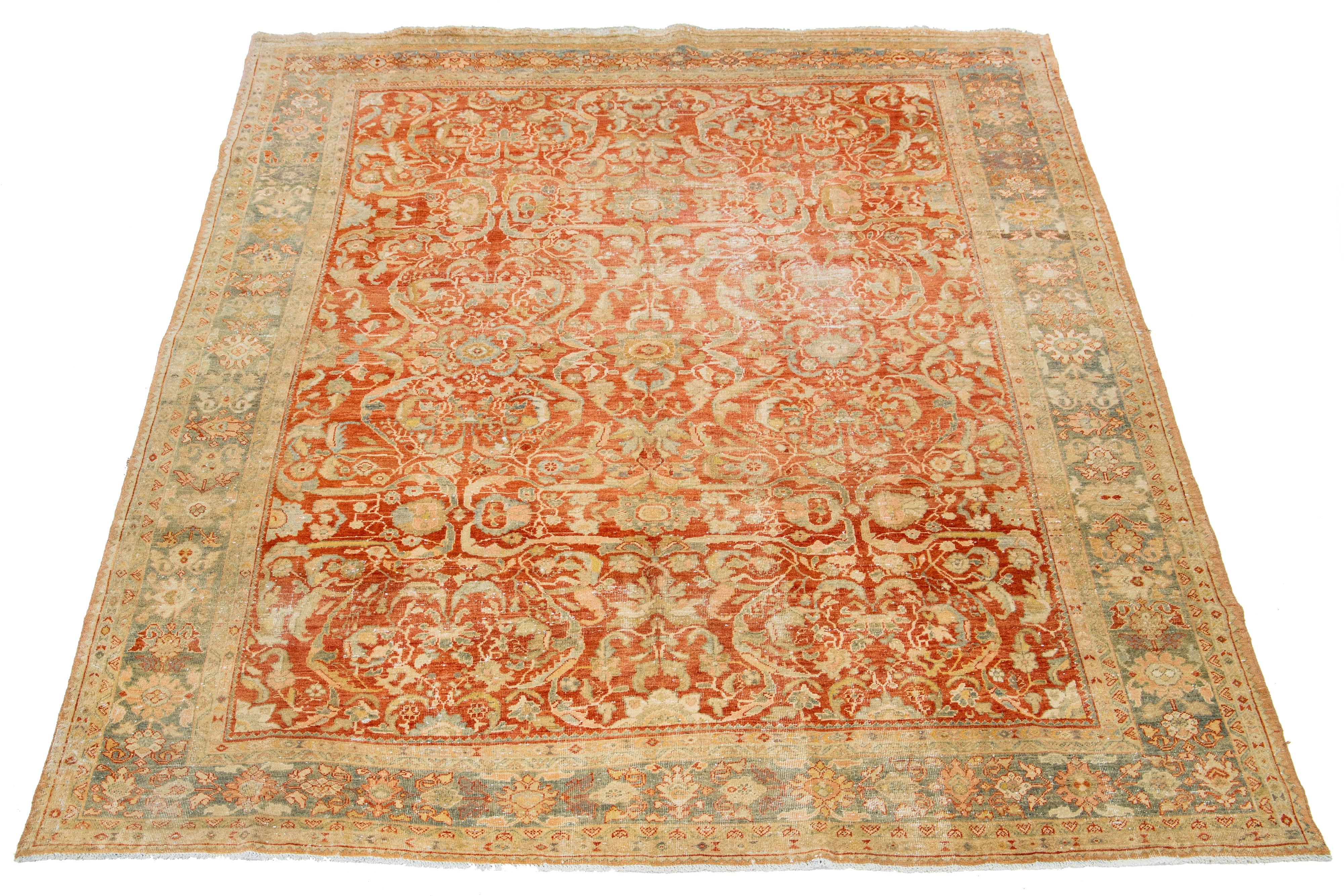 This Persian Heriz rug is handcrafted with wool that is knotted by hand. The field of the rug is adorned with a captivating design in a rust color, enhanced with beautiful shades of blue and peach.

This rug measures 8'10