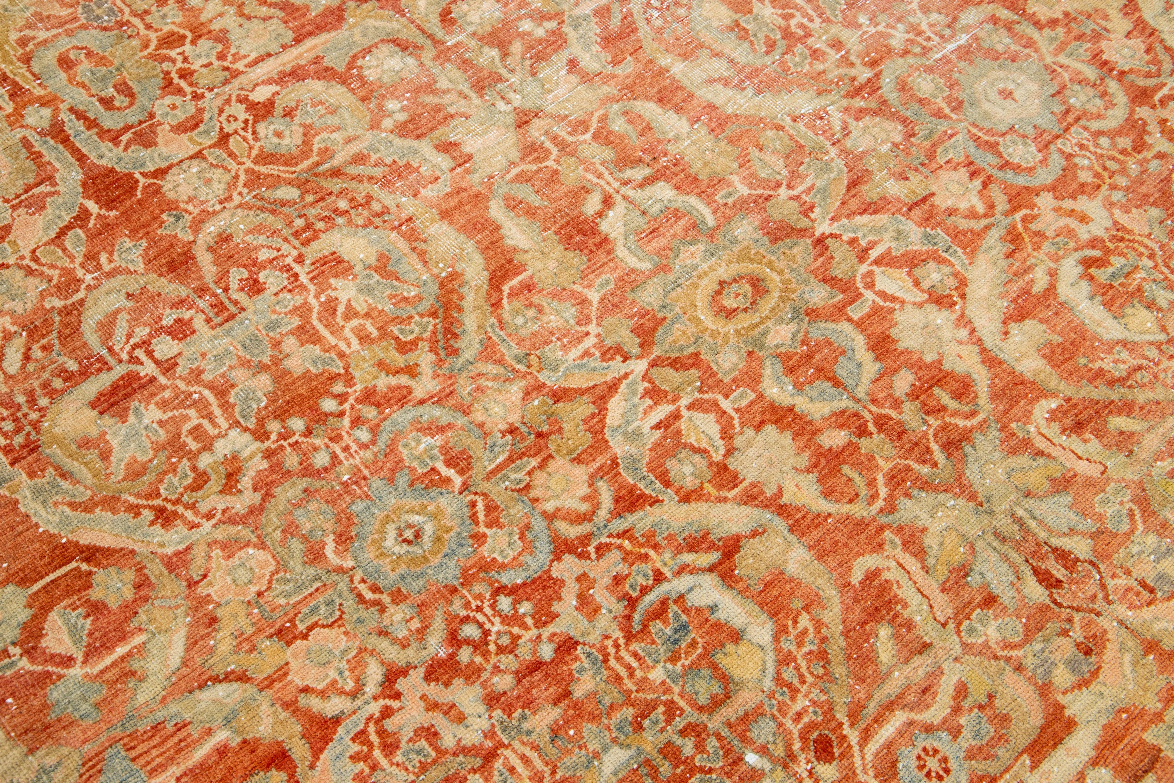 Hand-Knotted 1920s Antique Persian Heriz Wool Rug In Rust With Allover Floral Design  For Sale